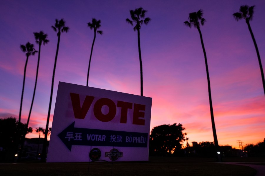 A sign directs the way to a polling place at Marina Park Community Center on Tuesday, Nov. 5, 2024, in Newport Beach, Calif. (AP Photo/Ashley Landis)