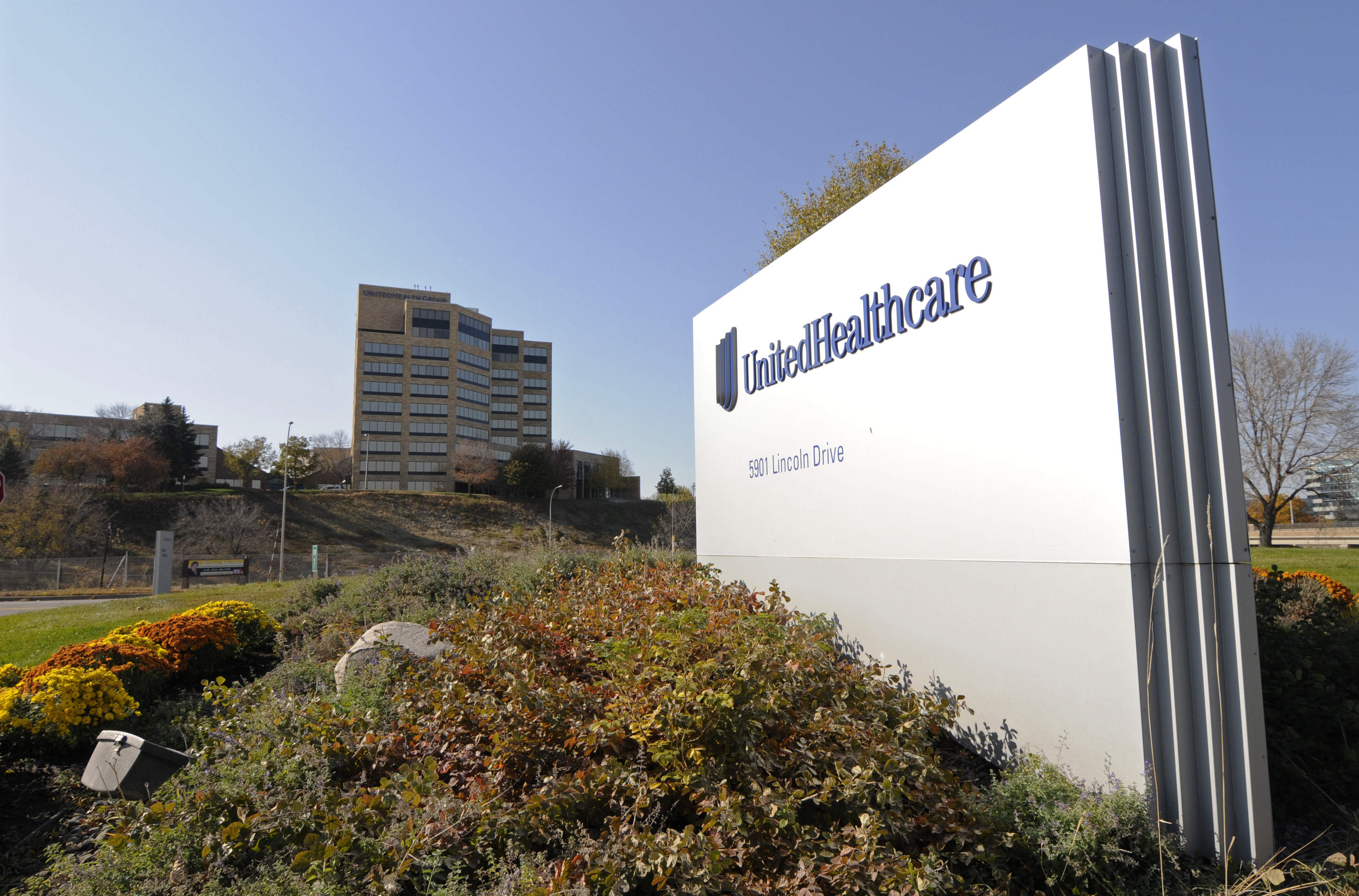 FILE - A sign stands on UnitedHealth Group Inc.'s campus in Minnetonka, Minn., Oct. 16, 2012. (AP Photo/Jim Mone, File)