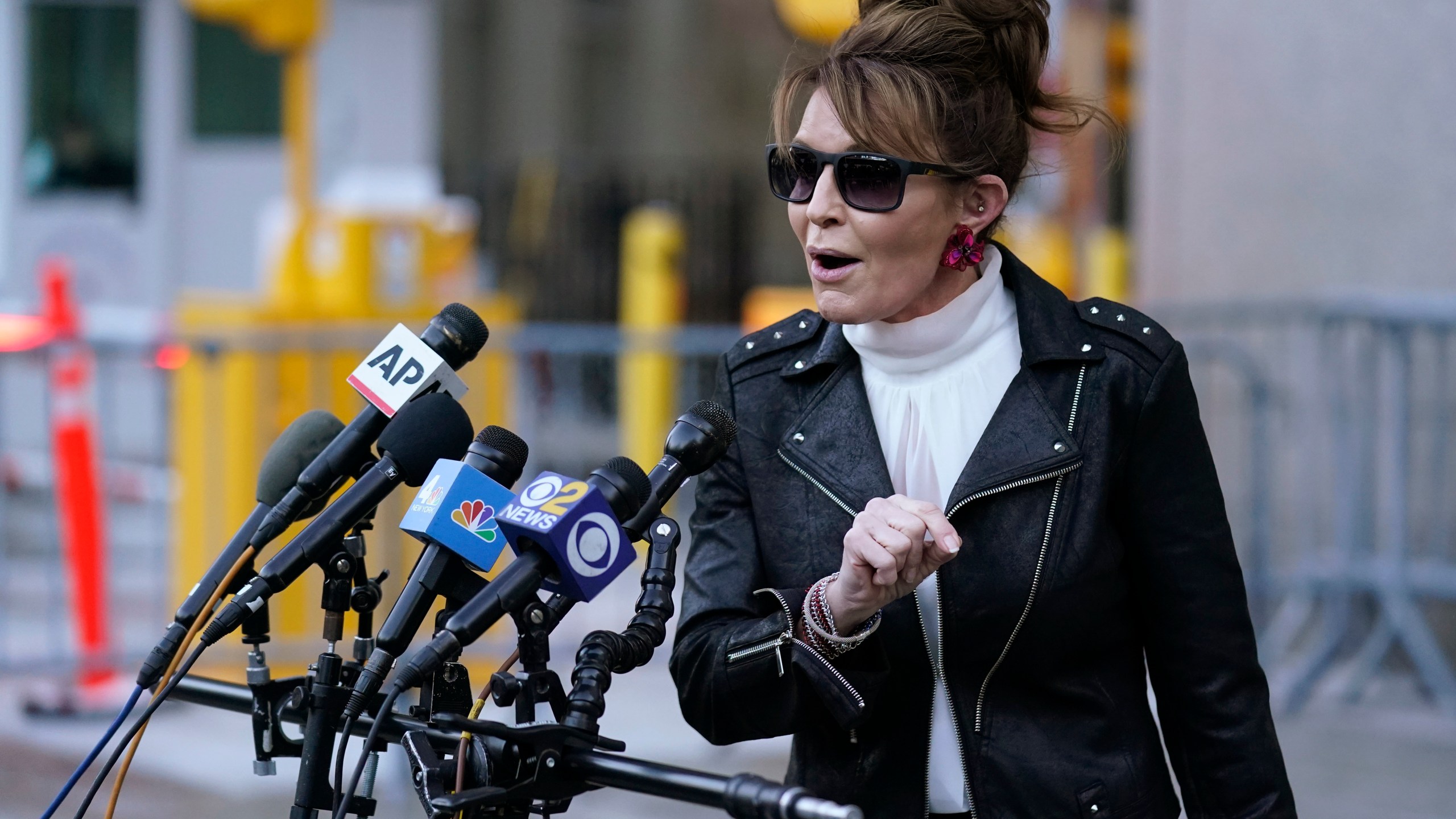 FILE - Former Alaska Gov. Sarah Palin speaks to reporters as she leaves a courthouse in New York, Feb. 14, 2022. (AP Photo/Seth Wenig, File)