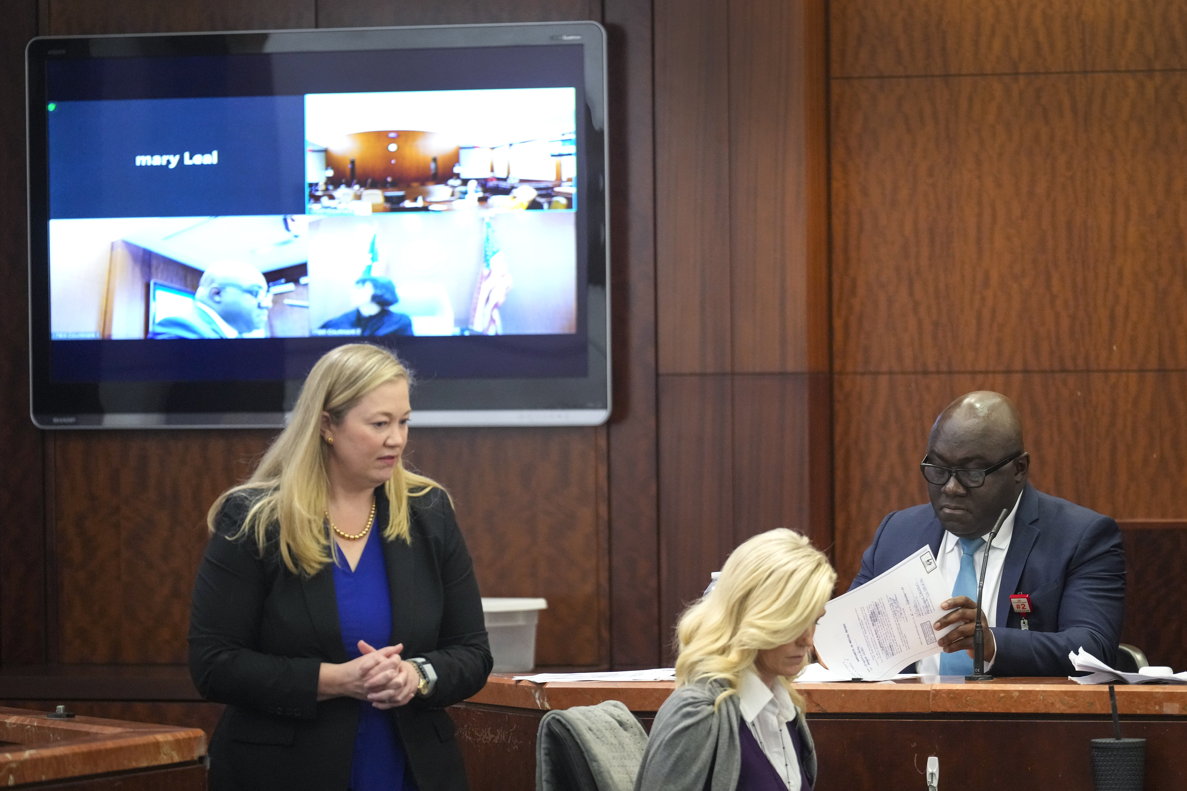 Prosecutor Celeste Byron, left, questions Dr. Kwabena Sarpong, of Texas Children's Hospital, during the punishment phase in Gloria Williams' trial, Tuesday, Nov. 12, 2024, at the Harris County Criminal Justice Center in Houston. (Brett Coomer/Houston Chronicle via AP)