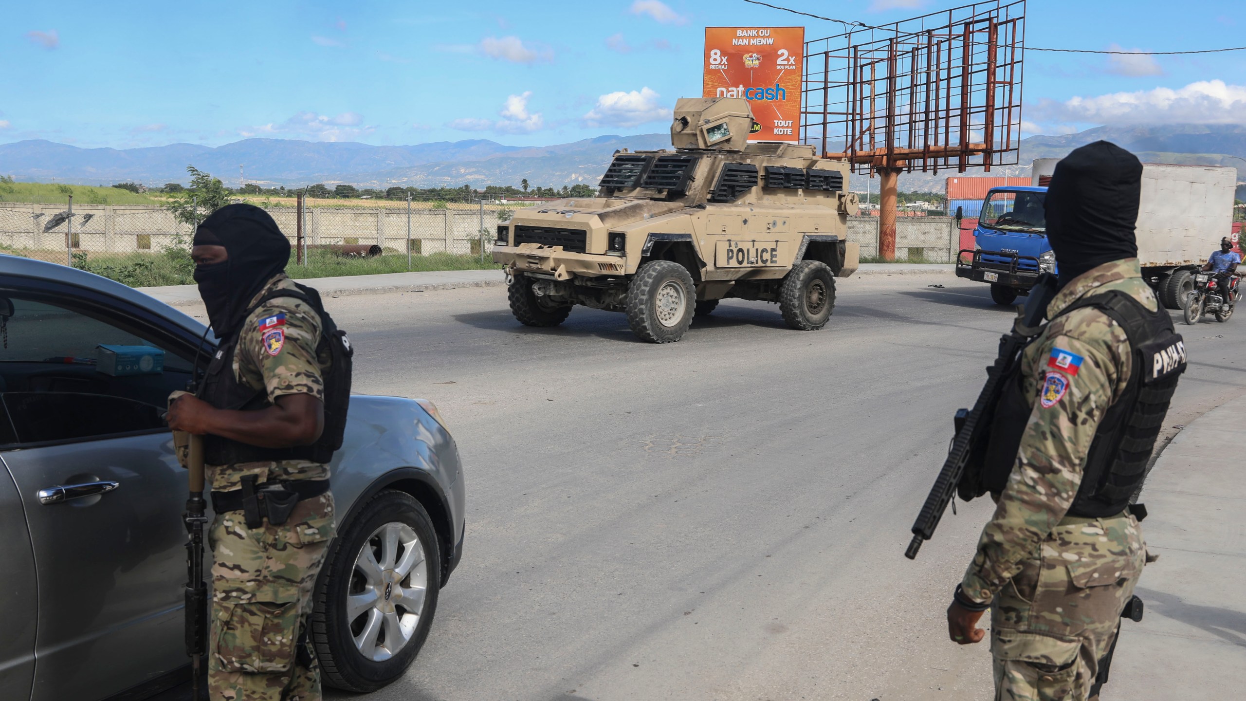 Police officers patrol near the Toussaint Louverture International Airport in Port-au-Prince, Haiti, Tuesday, Nov. 12, 2024. (AP Photo/Odelyn Joseph)