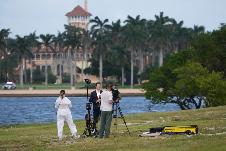 FILE - A television crew does a stand up across from the Mar-a-Lago estate of President-elect Donald Trump, Nov. 4, 2024, in Palm Beach, Fla. (AP Photo/Lynne Sladky, File)