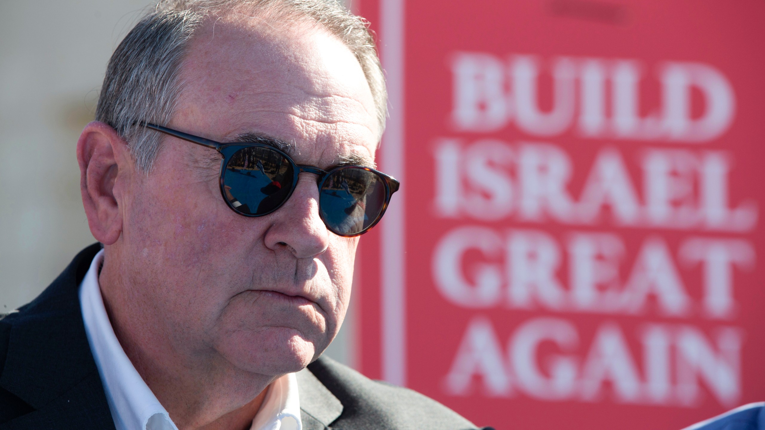 FILE - Gov. Mike Huckabee, R-Ark., takes questions from the media, prior to laying a brick at a new housing complex in the West Bank settlement of Efrat, Aug. 1, 2018. President-elect Donald Trump will nominate former Arkansas Gov. Mike Huckabee as ambassador to Israel. Trump said Tuesday that Huckabee is a staunch defender of Israel and his intended nomination comes as Trump has promised to align U.S. foreign policy more closely with Israel’s interests as it wages wars against Hamas in Gaza and Hezbollah in Lebanon.(AP Photo/Oded Balilty, File)