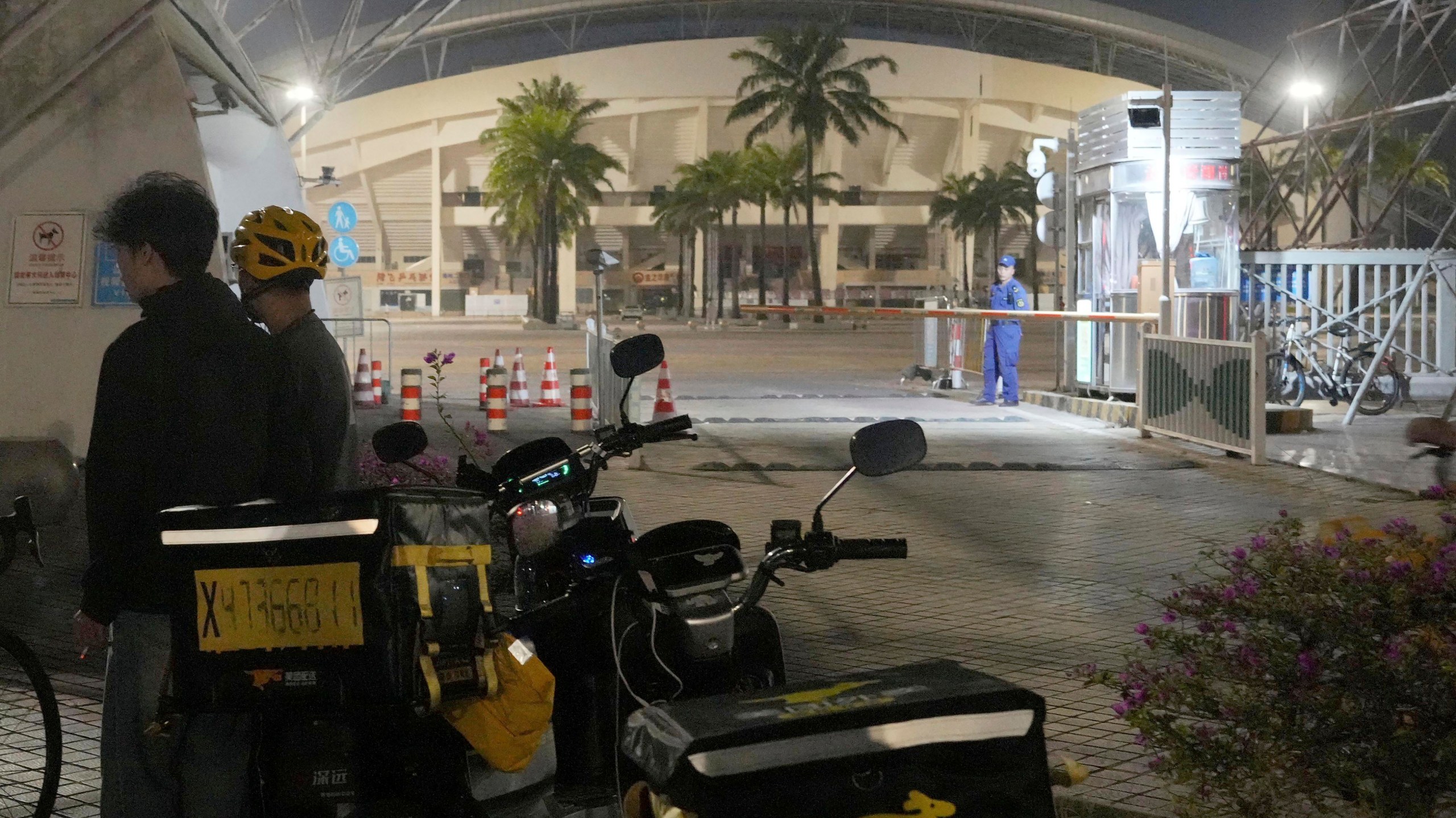 This photo shows a sports center where a man rammed a car into people exercising in Zhuhai, China Monday, Nov. 11, 2024. (Kyodo News via AP)