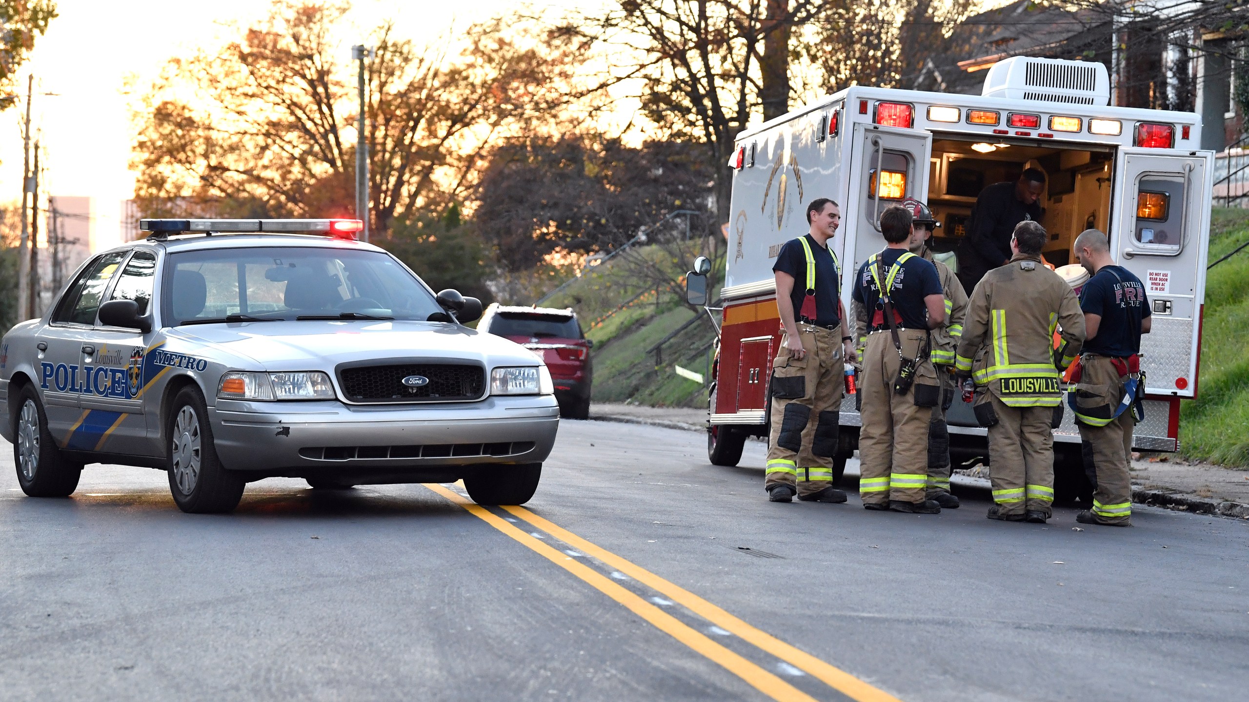 Members of the Louisville Fire Departments check their gear as they prepare to enter Givaudan Sense Colour following an explosion at the facility in Louisville, Ky., Tuesday, Nov. 12, 2024. (AP Photo/Timothy D. Easley)