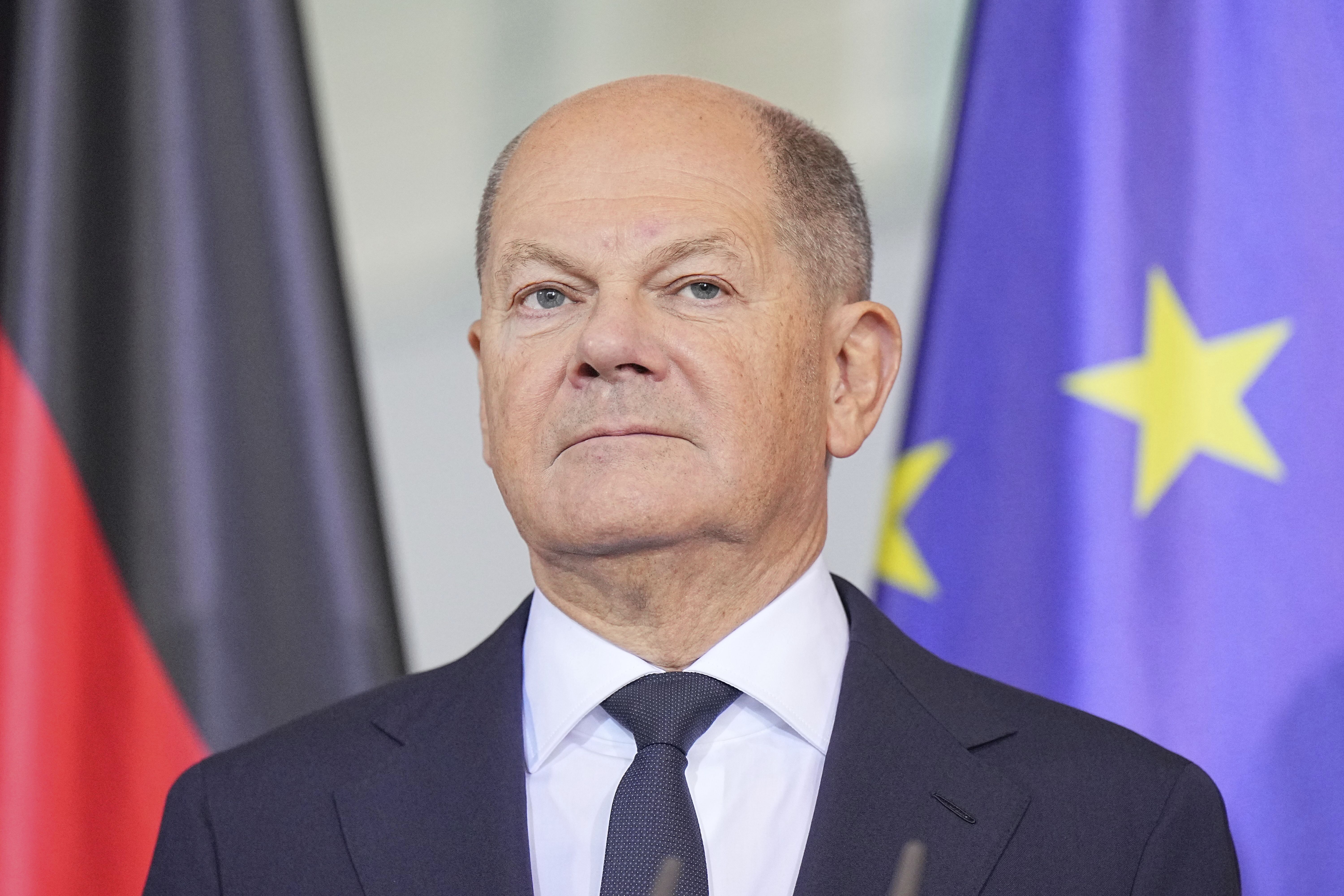 German Chancellor Olaf Scholz stands at the presentation of the annual report of the German Council of Economic Experts, in Berlin, Wednesday Nov. 13, 2024. (Michael Kappeler/dpa via AP)