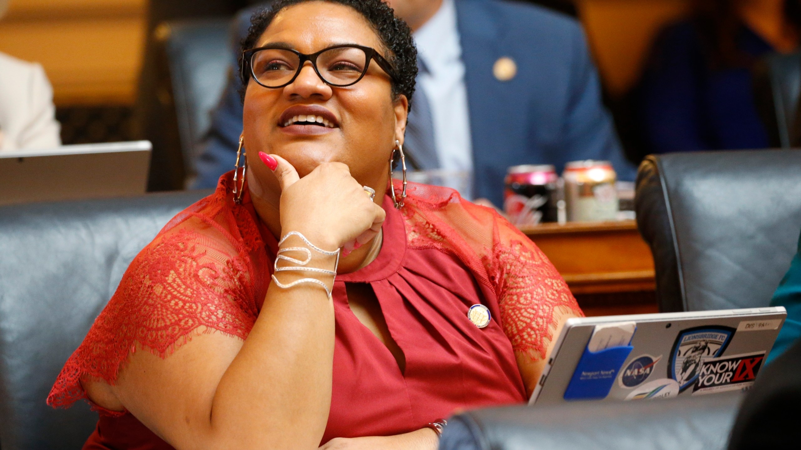 FILE - Del. Marcia 'Cia' Price, D-Newport News, looks at the vote tally board during the House session at the Capitol Wednesday, Feb. 19, 2020, in Richmond, Va. (AP Photo/Steve Helber, File)