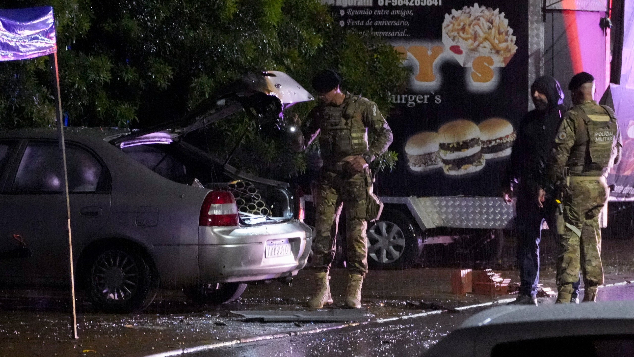 Police inspect a vehicle outside the Supreme Court in Brasília, Brazil, following an explosion, Wednesday, Nov. 13, 2024. (AP Photo/Eraldo Peres)