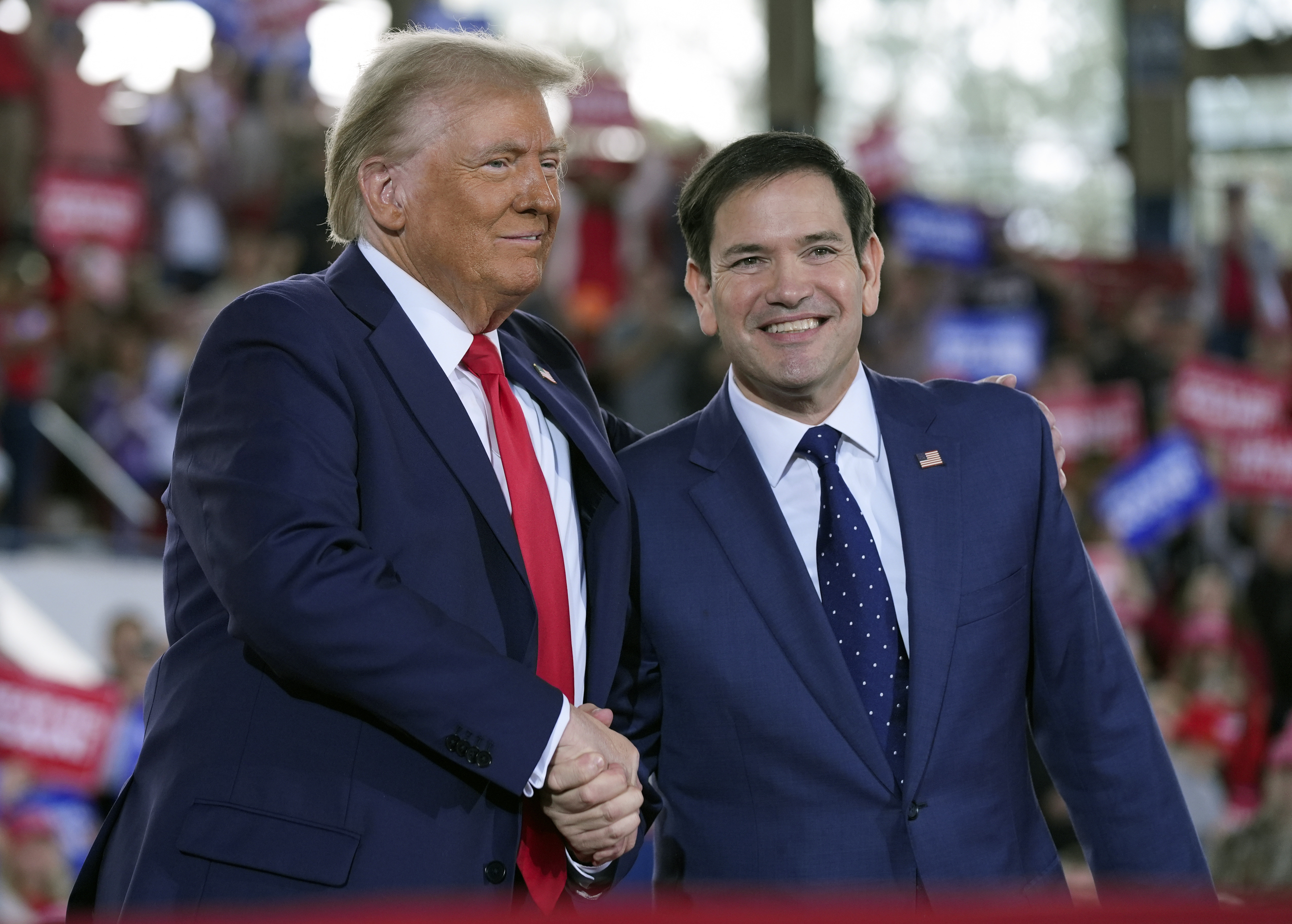 FILE - Republican presidential nominee former President Donald Trump greets Sen. Marco Rubio, R-Fla., during a campaign rally at J.S. Dorton Arena, Nov. 4, 2024, in Raleigh, N.C. (AP Photo/Evan Vucci, File)