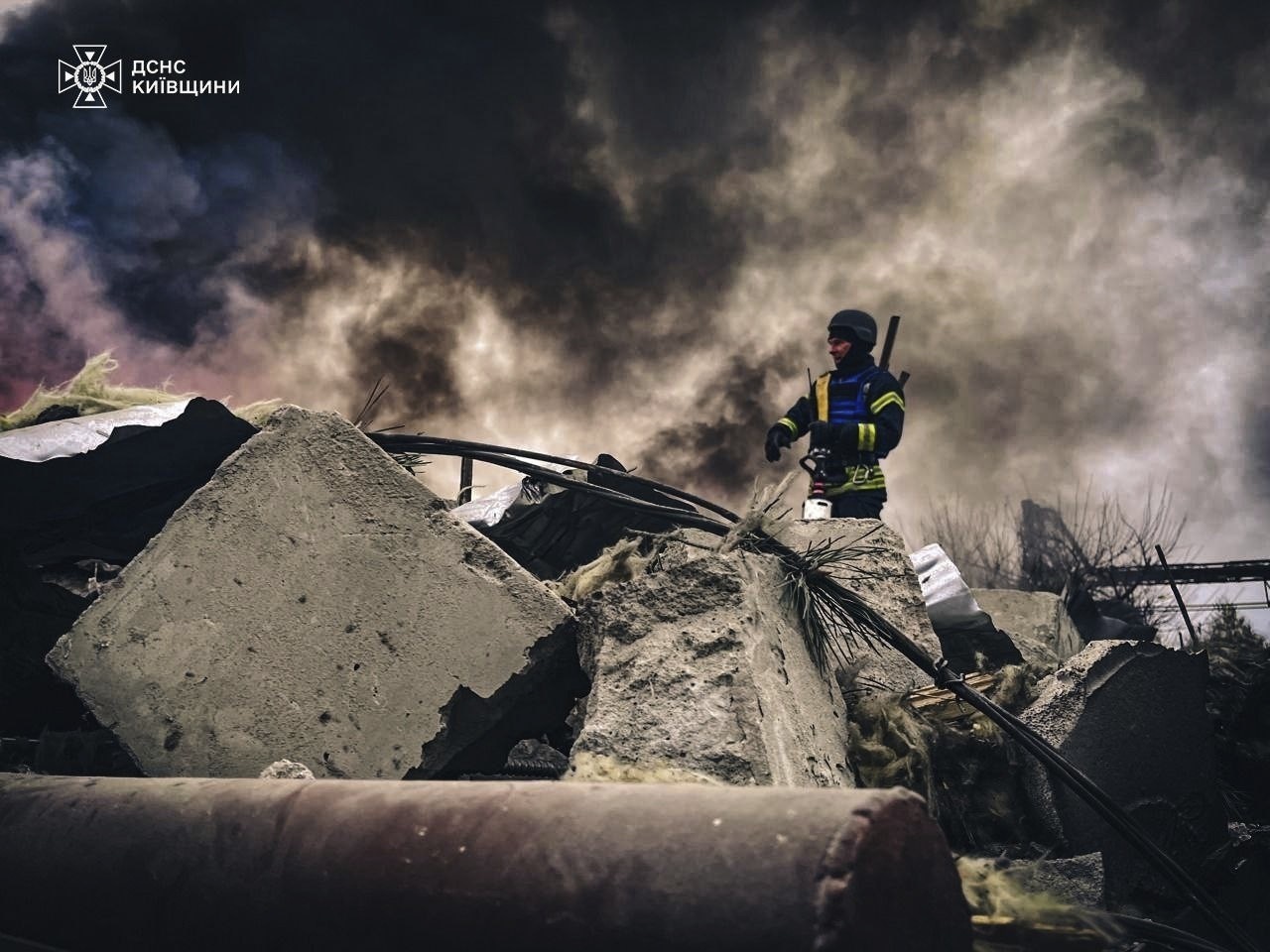 In this photo provided by the Ukrainian Emergency Service on Nov. 13, 2024, rescue workers clear the rubble of a building destroyed by a Russian strike in Brovary, outside Kyiv, Ukraine. (Ukrainian Emergency Service via AP)