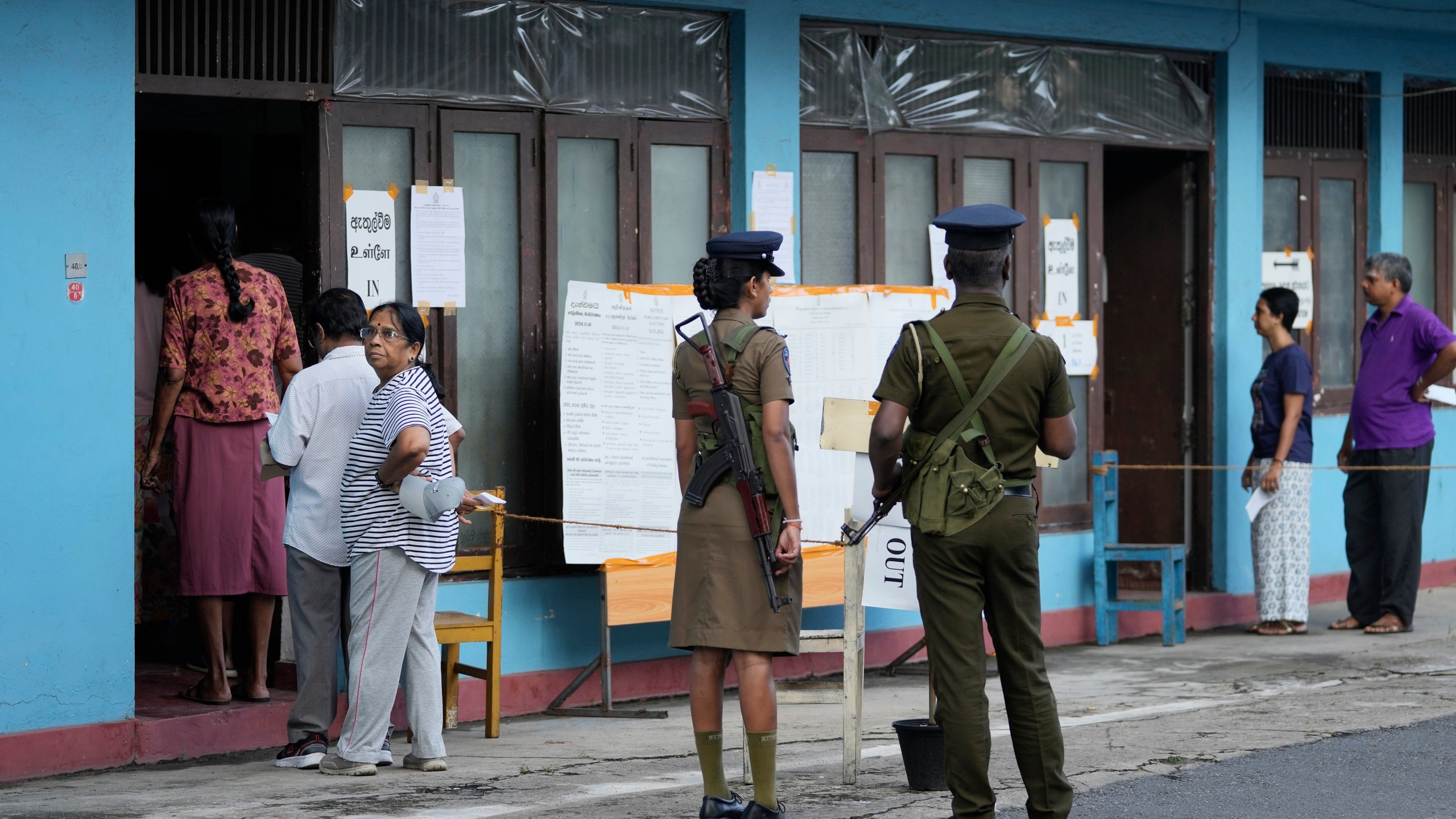 People arrive to cast their votes at a polling station during the parliamentary election in Colombo, Sri Lanka, Thursday, Nov. 14, 2024.(AP Photo/Eranga Jayawardena)