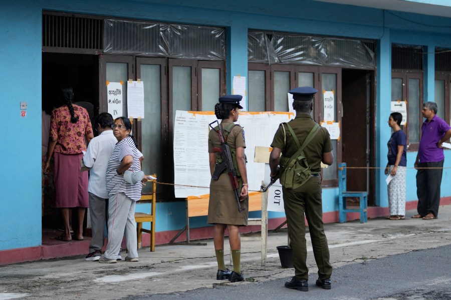 People arrive to cast their votes at a polling station during the parliamentary election in Colombo, Sri Lanka, Thursday, Nov. 14, 2024.(AP Photo/Eranga Jayawardena)