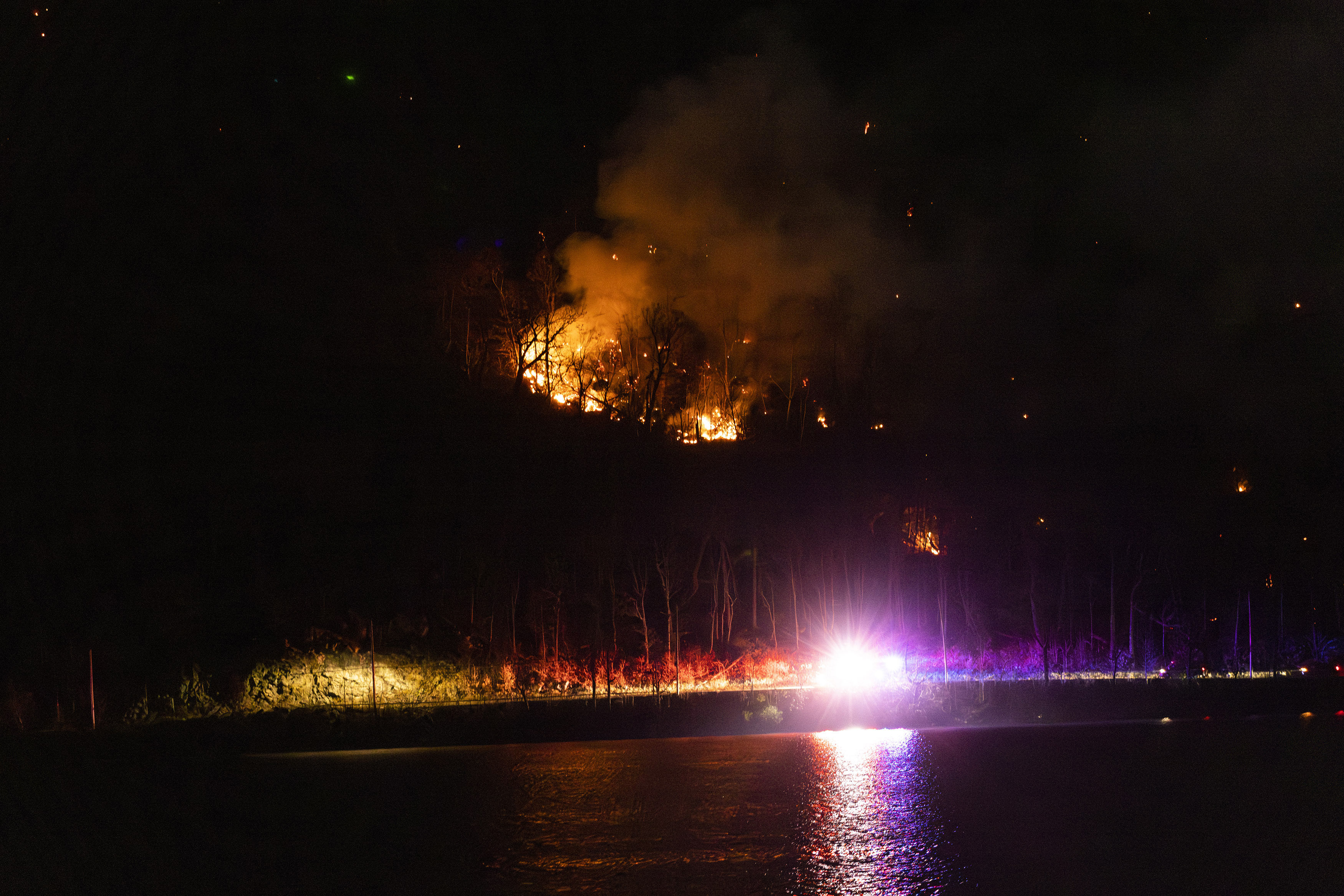 Wildfires burn along the New York and New Jersey border in Greenwood Lake, New York, Wednesday, Nov. 13, 2024. (AP Photo/Eduardo Munoz Alvarez)