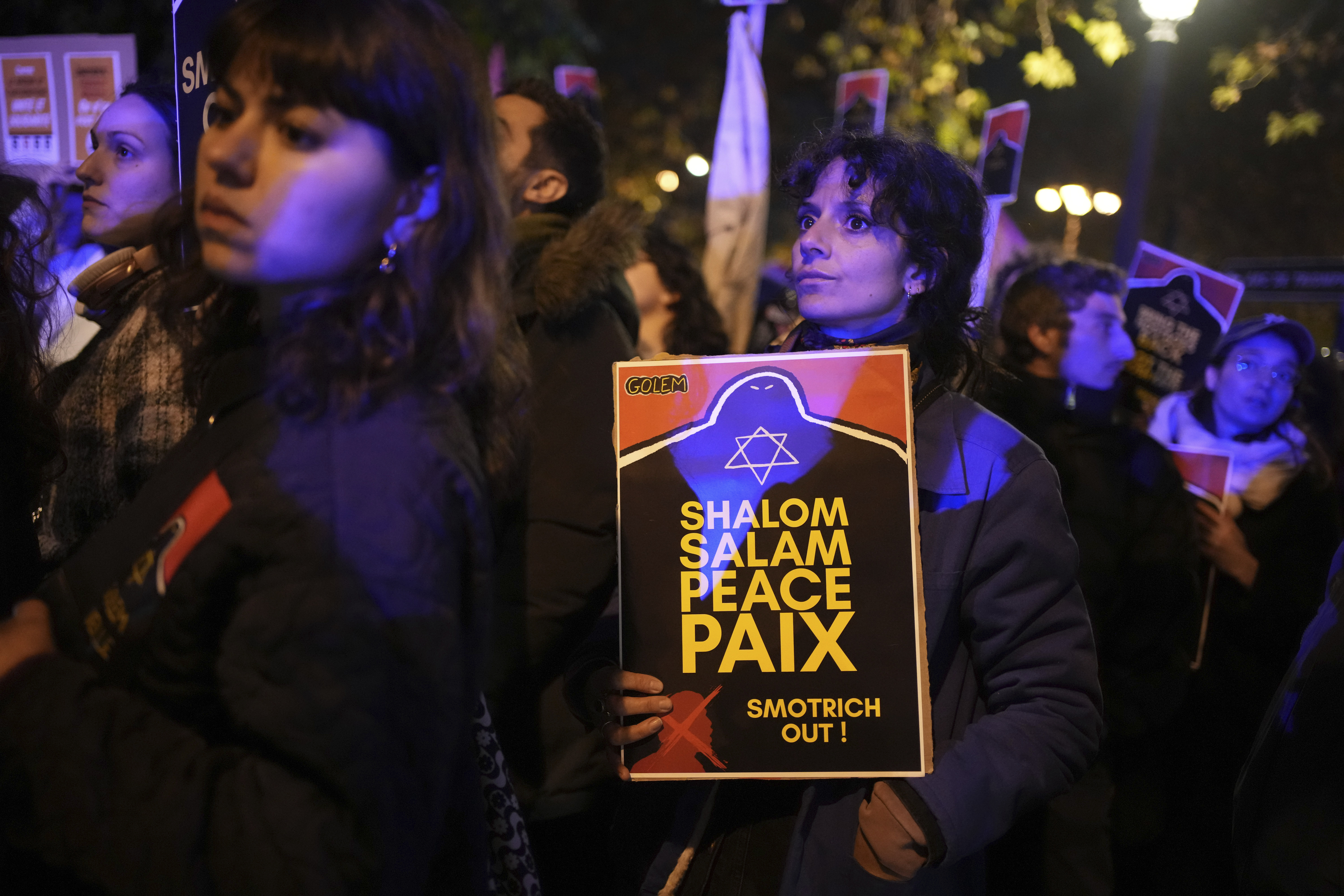 Protesters take part in a rally against the "Israel is Forever" gala organized by far-right Franco-Israeli figures, in Paris, Wednesday, Nov. 13, 2024, on the eve of the UEFA Nations League 2025 soccer match between France and Israel. (AP Photo/Christophe Ena)