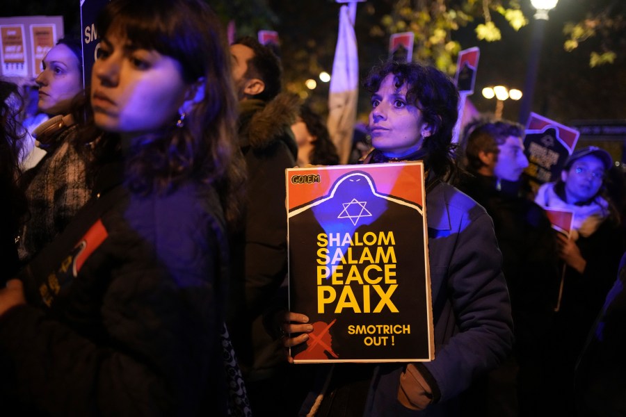 Protesters take part in a rally against the "Israel is Forever" gala organized by far-right Franco-Israeli figures, in Paris, Wednesday, Nov. 13, 2024, on the eve of the UEFA Nations League 2025 soccer match between France and Israel. (AP Photo/Christophe Ena)