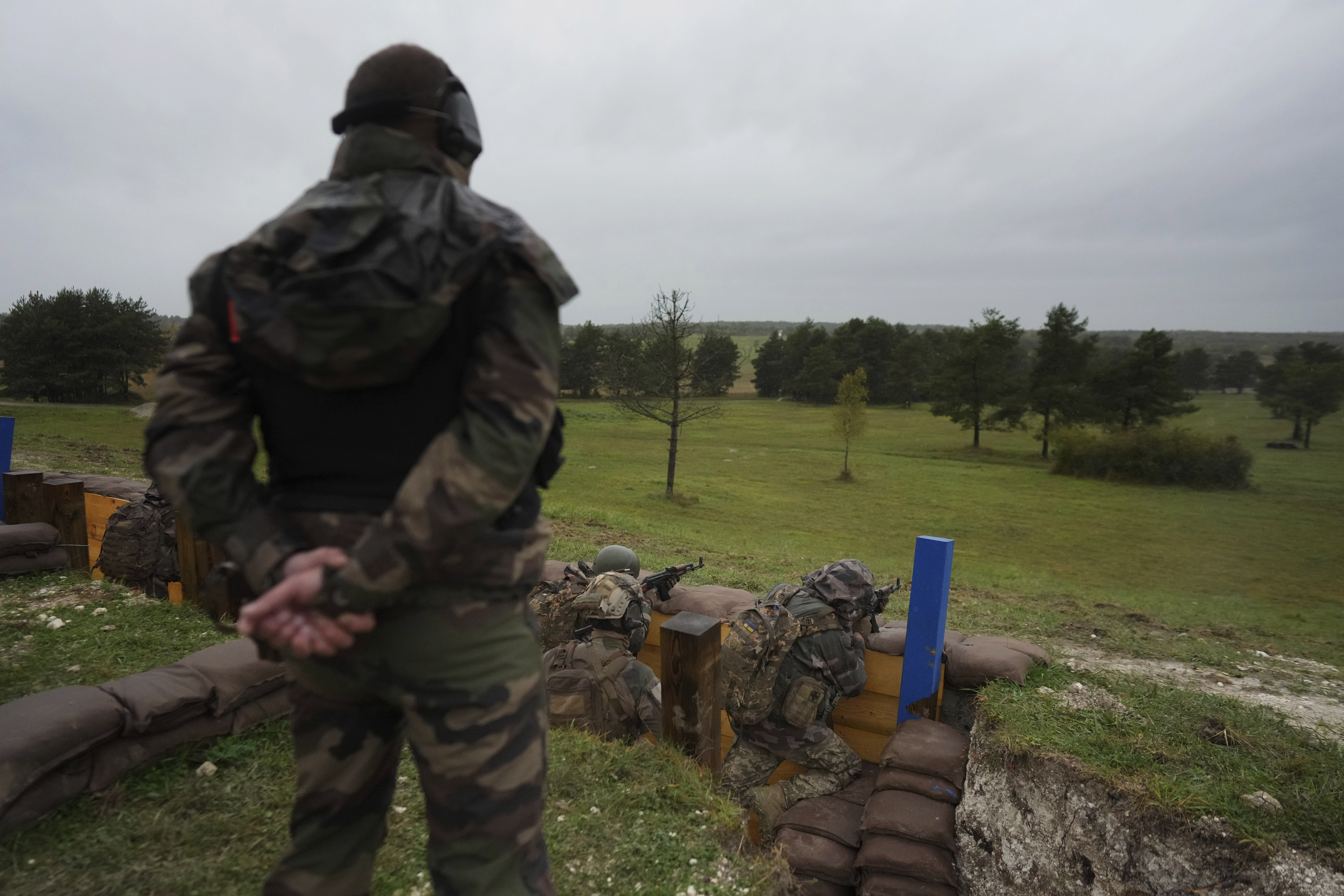 FILE - Ukrainian soldiers train at a military camp in eastern France, Wednesday, Oct. 9, 2024. (AP Photo/Thibault Camus, Pool, File)