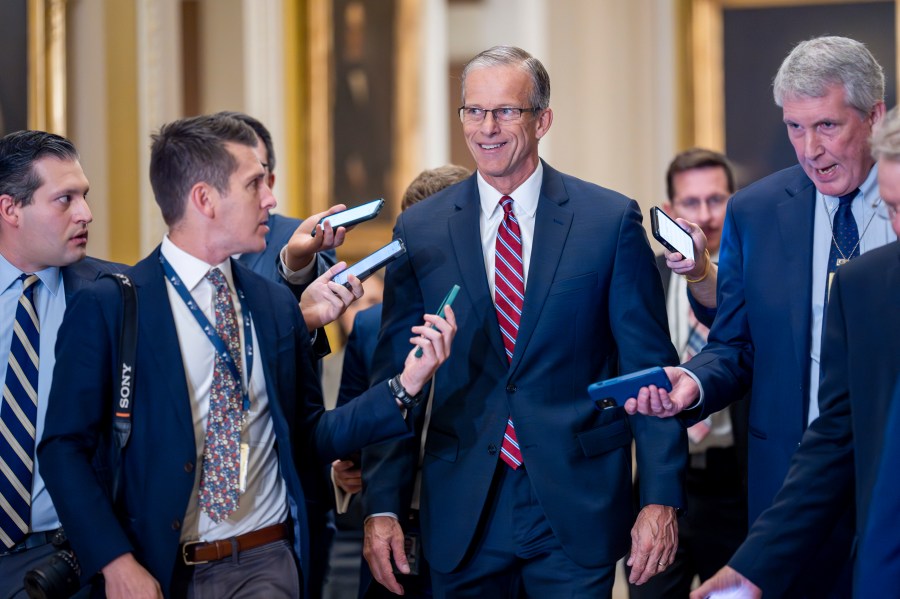 Senate Minority Whip John Thune, R-S.D., walks with reporters on the way to being elected to succeed longtime GOP leader Mitch McConnell of Kentucky, at the Capitol in Washington, Wednesday, Nov. 13, 2024.