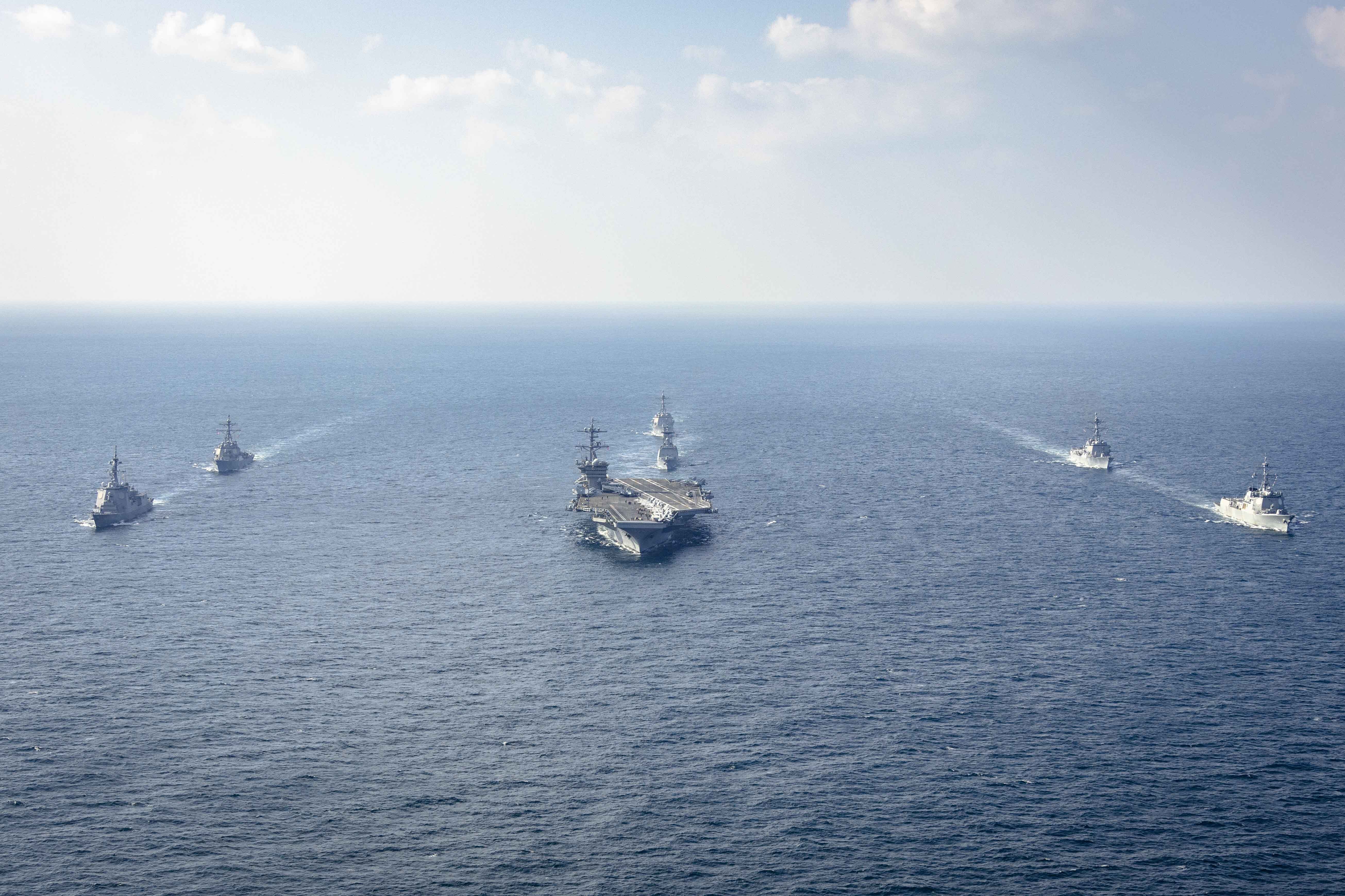 In this photo provided by South Korea Defense Ministry, warships of South Korea, the United States and Japan including the USS George Washington aircraft carrier, bottom center, take part in the trilateral Freedom Edge exercise in international waters off South Korea's southern island of Jeju, Wednesday, Nov. 13, 2024. (South Korea Defense Ministry via AP)