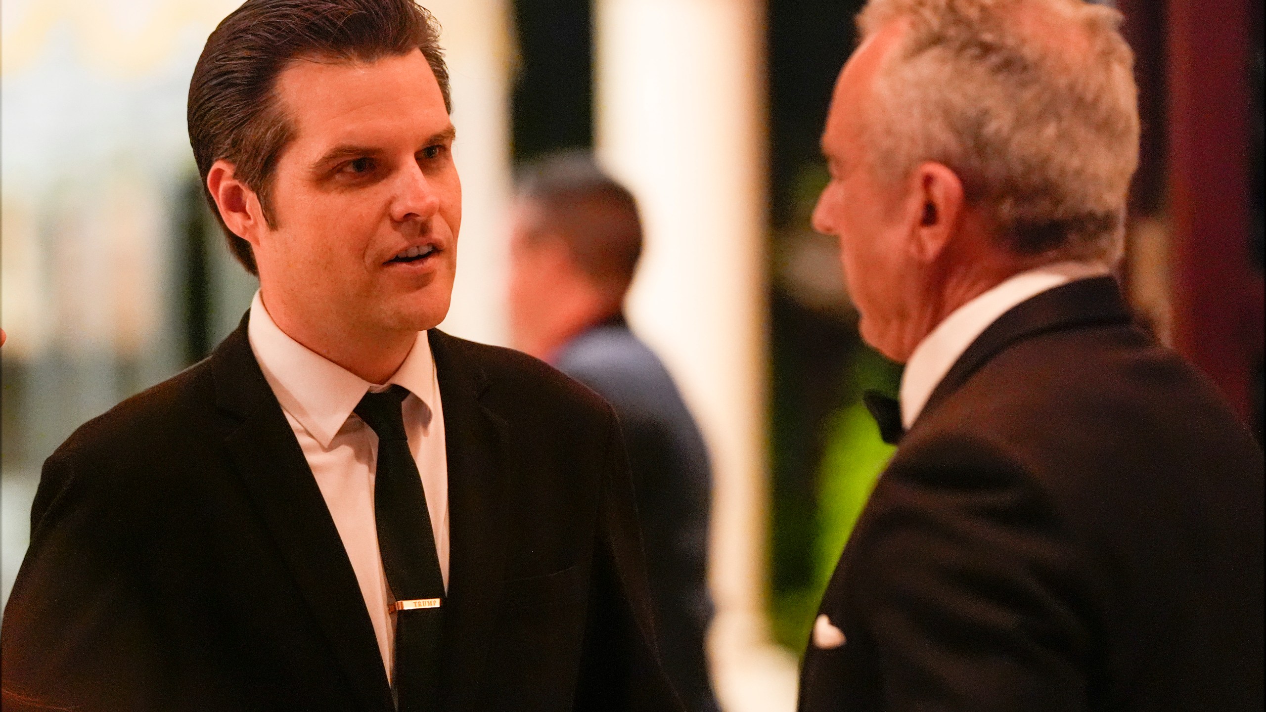 Matt Gaetz talks with Robert F. Kennedy Jr., before President-elect Donald Trump speaks during an America First Policy Institute gala at his Mar-a-Lago estate, Thursday, Nov. 14, 2024, in Palm Beach, Fla. (AP Photo/Alex Brandon)