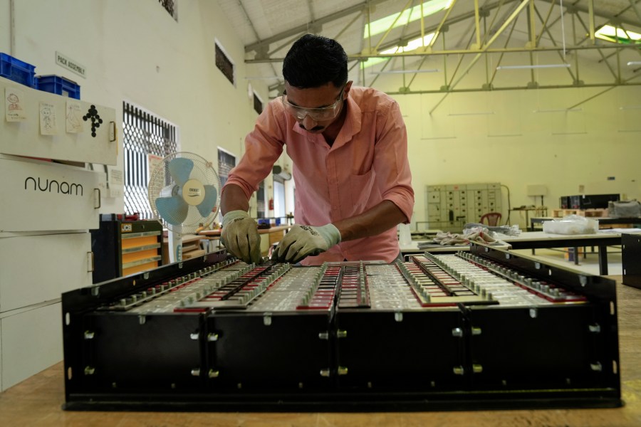 Sandip Varute, a battery production engineer at Nunam, assembles a refurbished battery pack, made from used electric vehicle batteries, at their facility in Bengaluru, India, Tuesday, Oct. 8, 2024. (AP Photo/Aijaz Rahi)