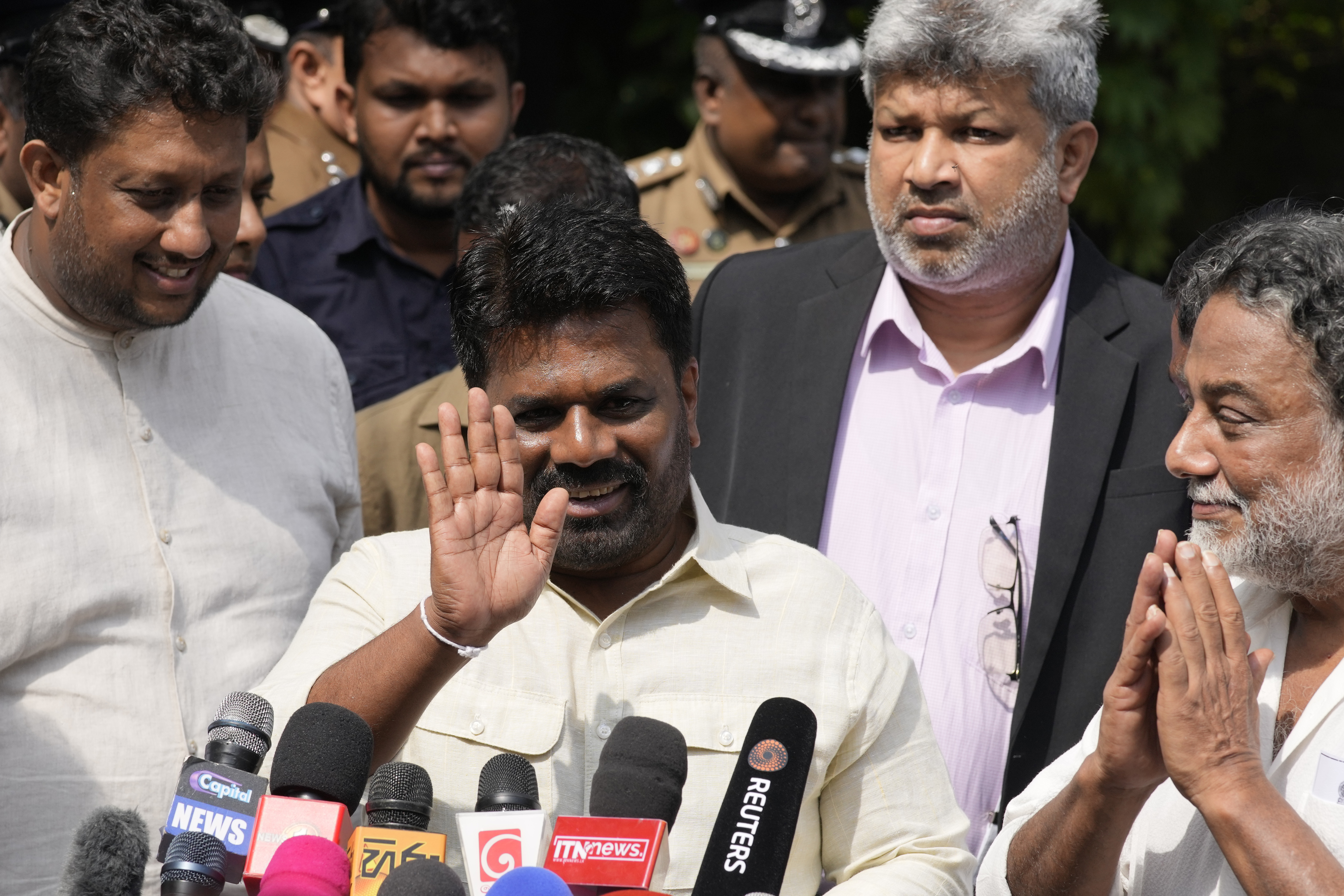 Sri Lankan President Anura Kumara Dissanayake leaves after casting his vote during the parliamentary election in Colombo, Sri Lanka, Thursday, Nov. 14, 2024.(AP Photo/Eranga Jayawardena)