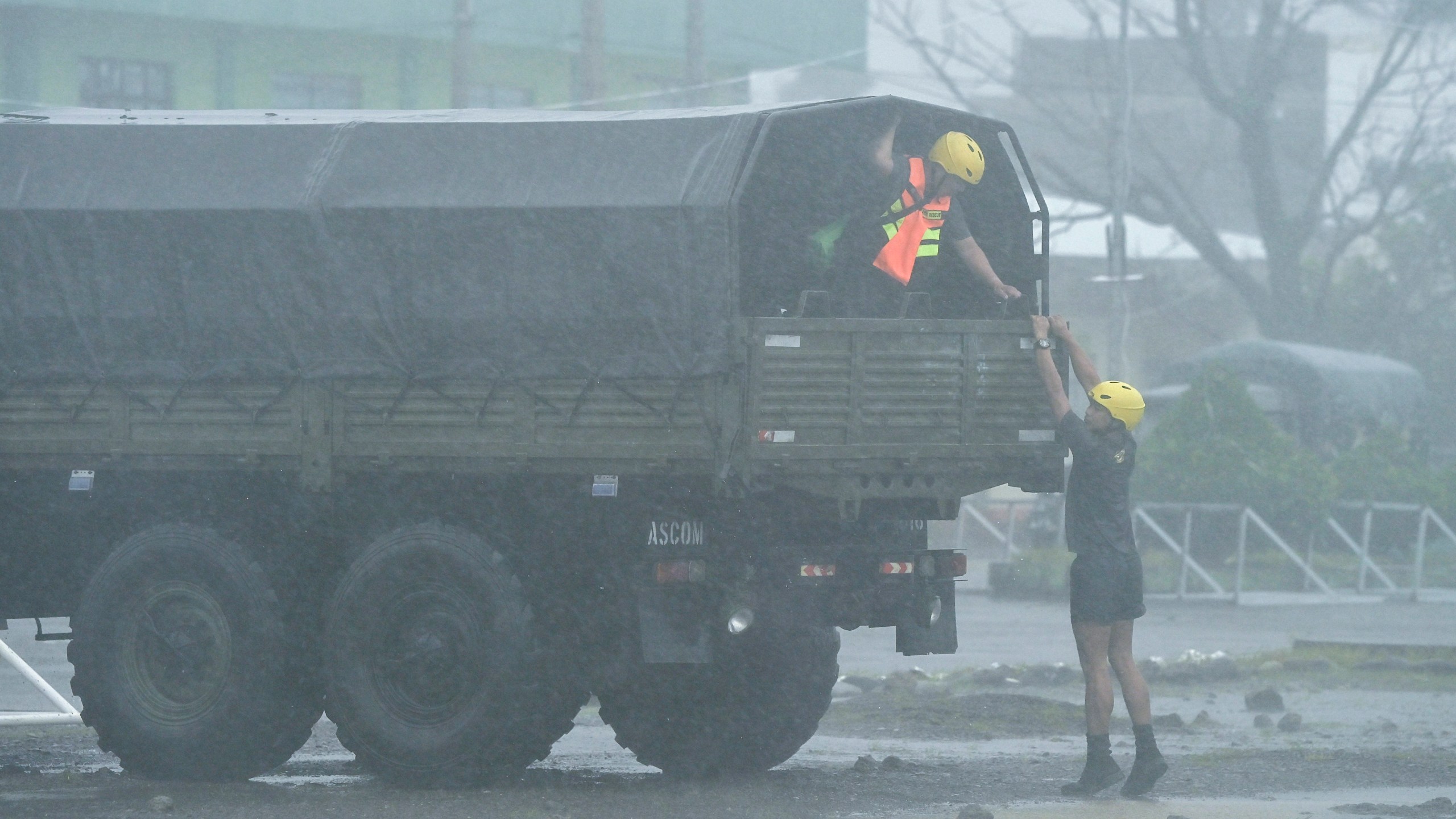 Rescuers prepare during heavy rains caused by Typhoon Usagi at Santa Ana, Cagayan province, northern Philippines on Thursday, Nov. 14, 2024. (AP Photo/Noel Celis)