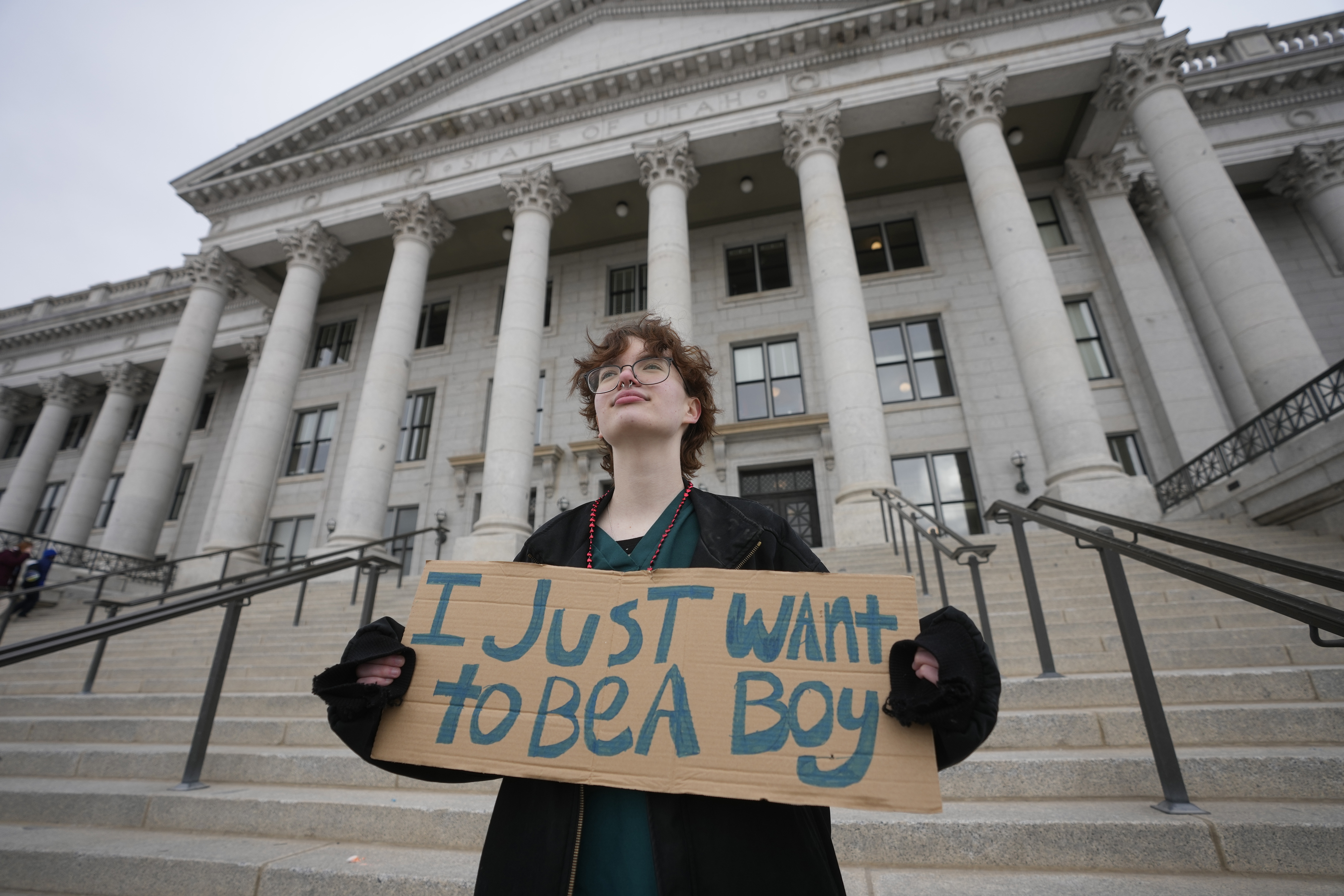 FILE - Tree Crane, 17, stands for a portrait following a rally where hundreds gathered in support of transgender youth at the Utah State Capitol Tuesday, Jan. 24, 2023, in Salt Lake City. (AP Photo/Rick Bowmer, File)