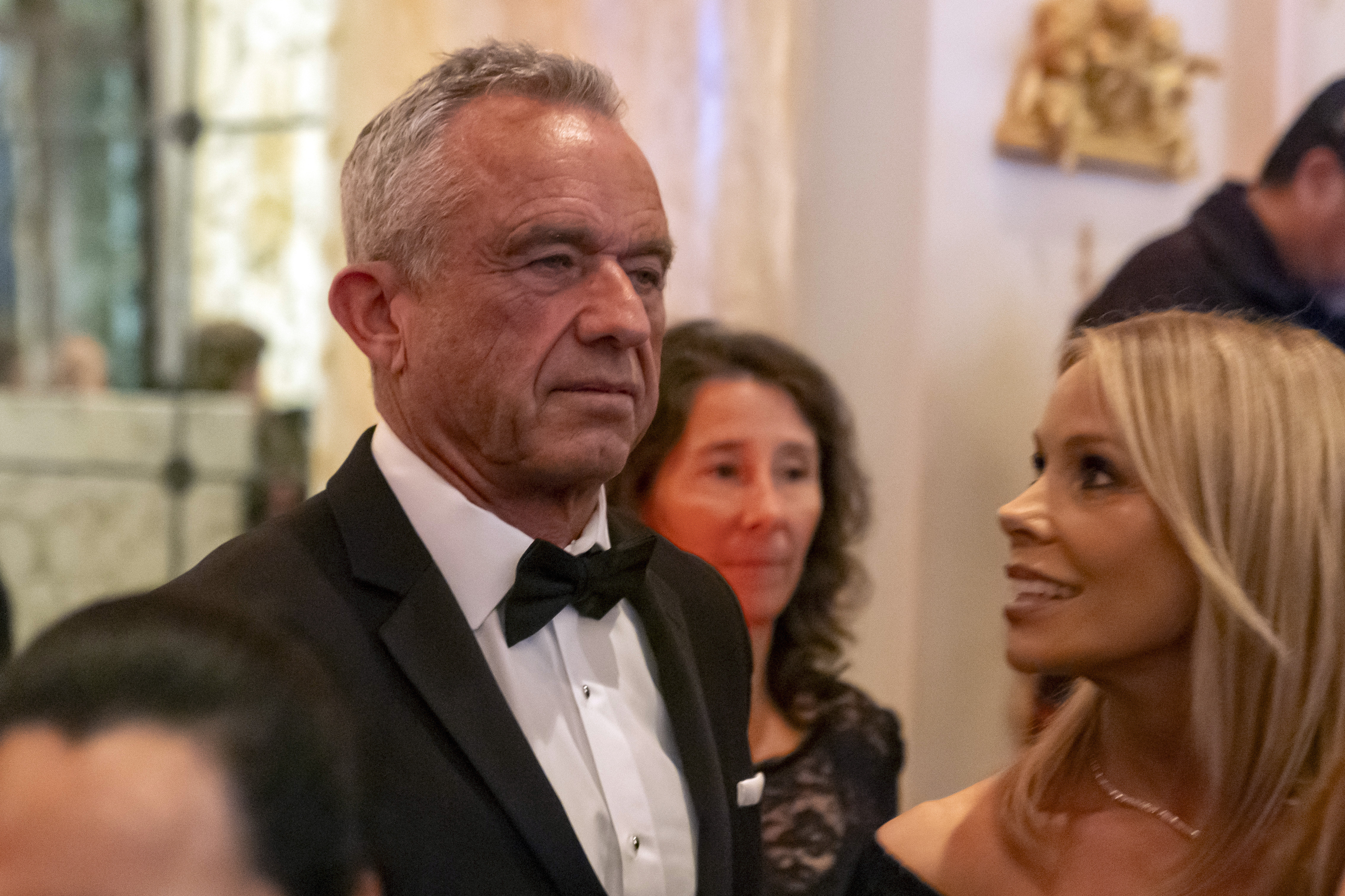 Robert F. Kennedy Jr., and his wife Cheryl Hines arrive before President-elect Donald Trump speaks during an America First Policy Institute gala at his Mar-a-Lago estate, Thursday, Nov. 14, 2024, in Palm Beach, Fla. (AP Photo/Alex Brandon)