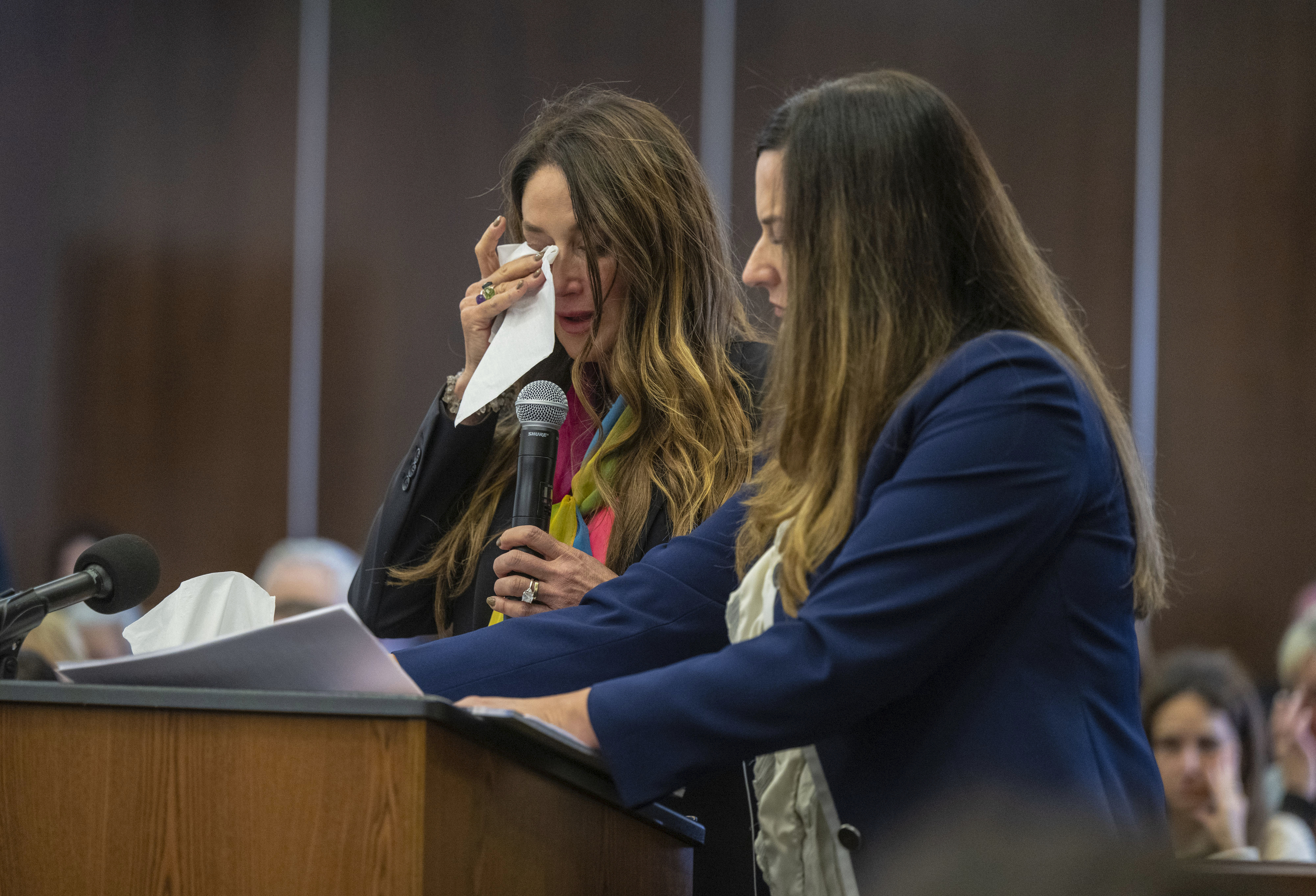 Jeanne Pepper, left, mother of Blaze Bernstein, wipes away tears as she gives a victim impact statement in court in Santa Ana, Calif., Friday, Nov. 15, 2024, prior to sentencing of Samuel Woodward, who was convicted of a hate crime murder for the killing of former classmate Blaze Bernstein. Senior Deputy District Attorney Jennifer Walker stands at right. (Mark Rightmire/The Orange County Register via AP, Pool)