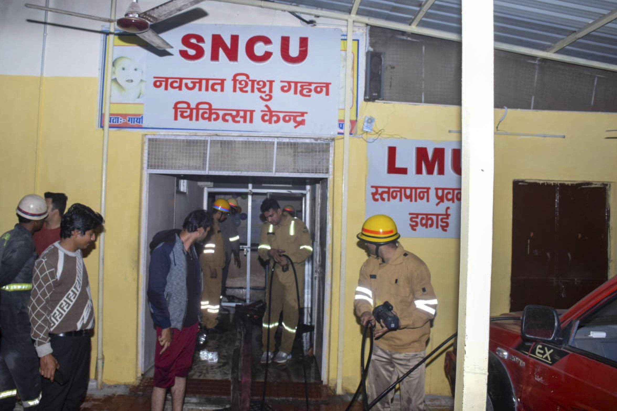 Firefighters work after a fire broke out in a neonatal intensive care unit at Jhansi Medical College hospital, in Jhansi, India, Friday, Nov. 15, 2024. (AP Photo)