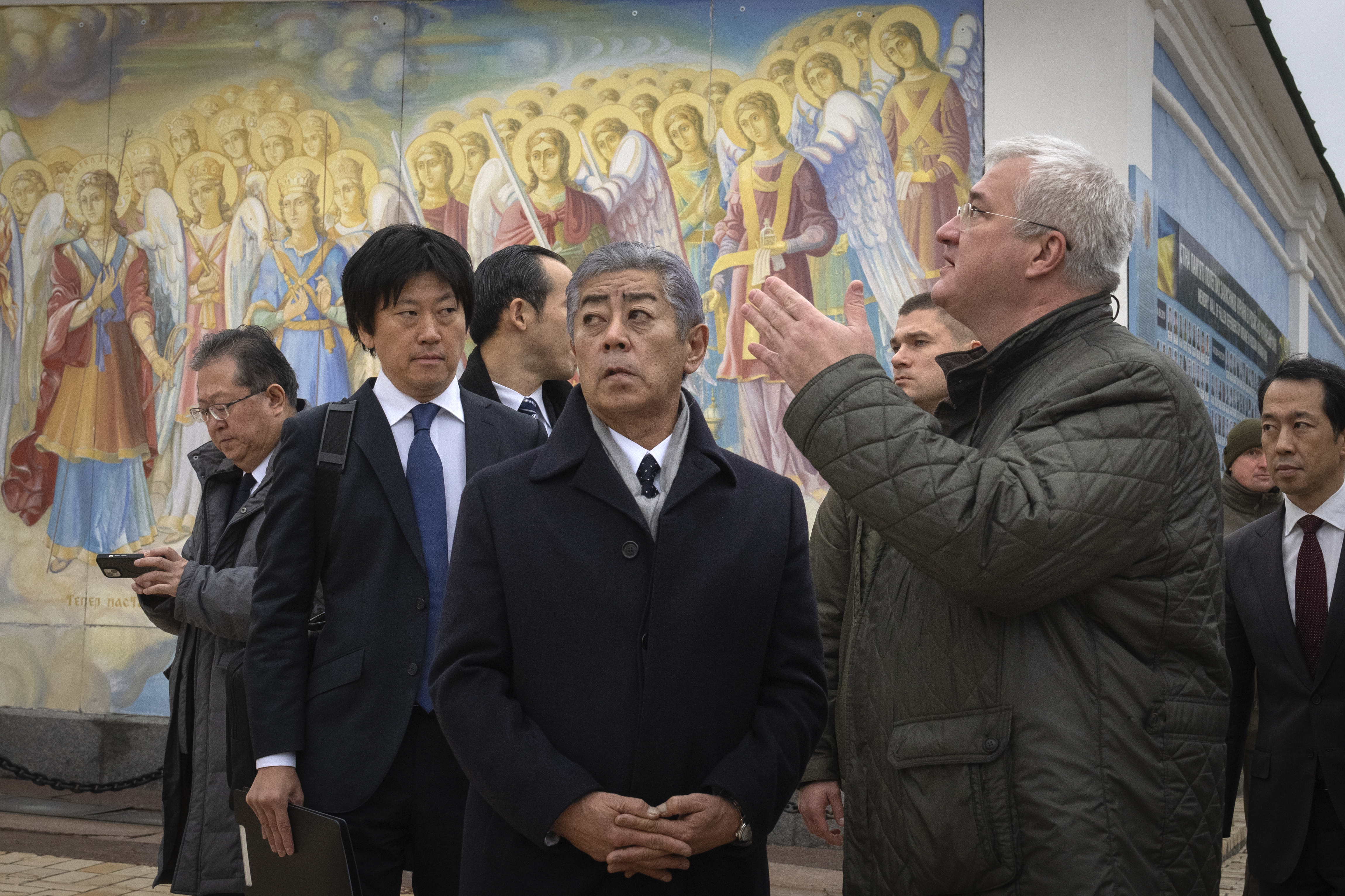 Japanese Foreign Minister Takeshi Iwaya, center, with Ukraine's Foreign Minister Andriiy Sybiha at the entrance of St. Michael Monastery in Kyiv, Ukraine, Saturday, Nov. 16, 2024. (AP Photo/Efrem Lukatsky)