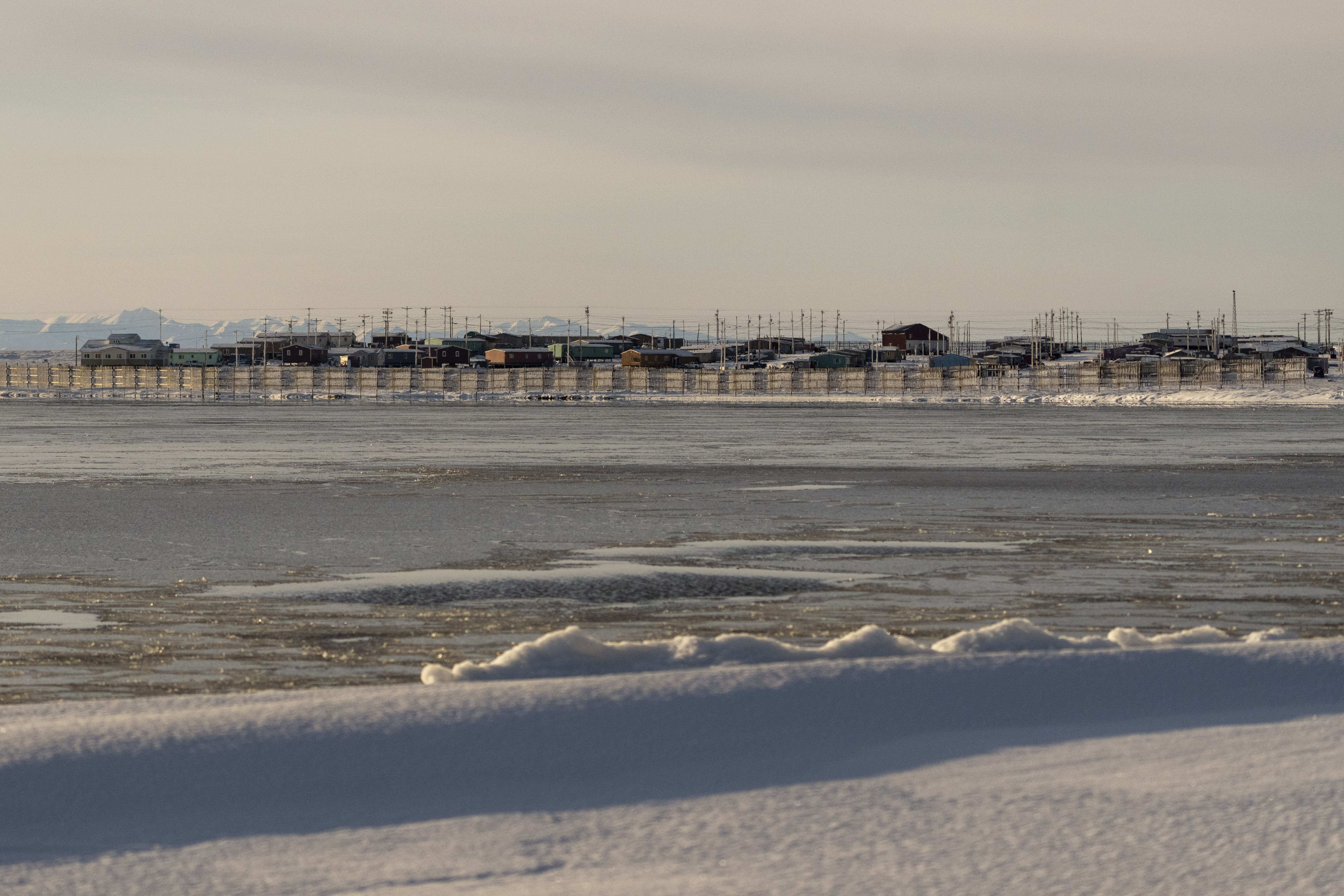 The village of Kaktovik is seen from across the waters of Pipsuk Bight, Tuesday, Oct. 15, 2024, in Kaktovik, Alaska. (AP Photo/Lindsey Wasson)