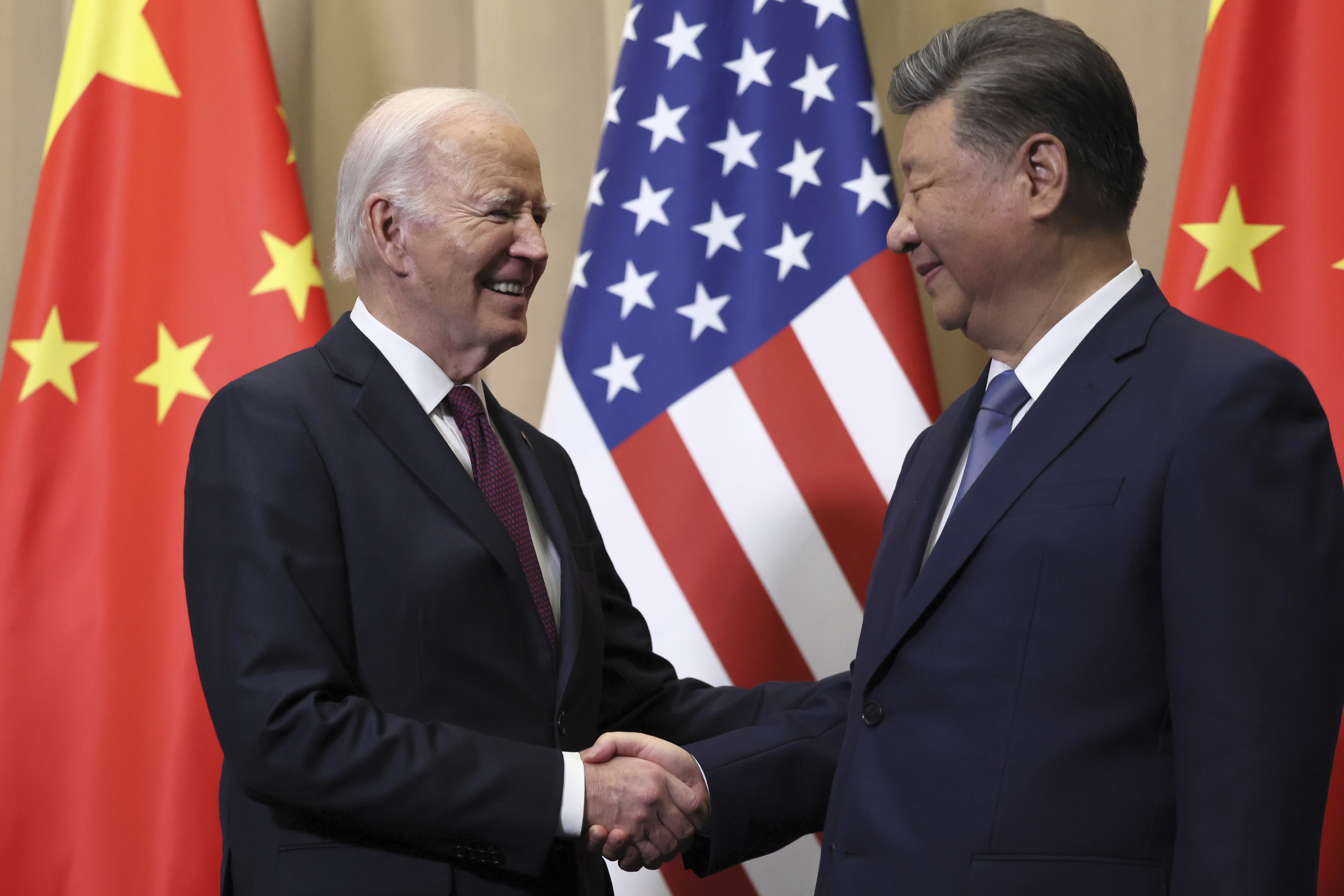 President Joe Biden shakes hands with Chinese President Xi Jinping before a bilateral meeting, Saturday, Nov. 16, 2024, in Lima, Peru. (Leah Millis/Pool Photo via AP)