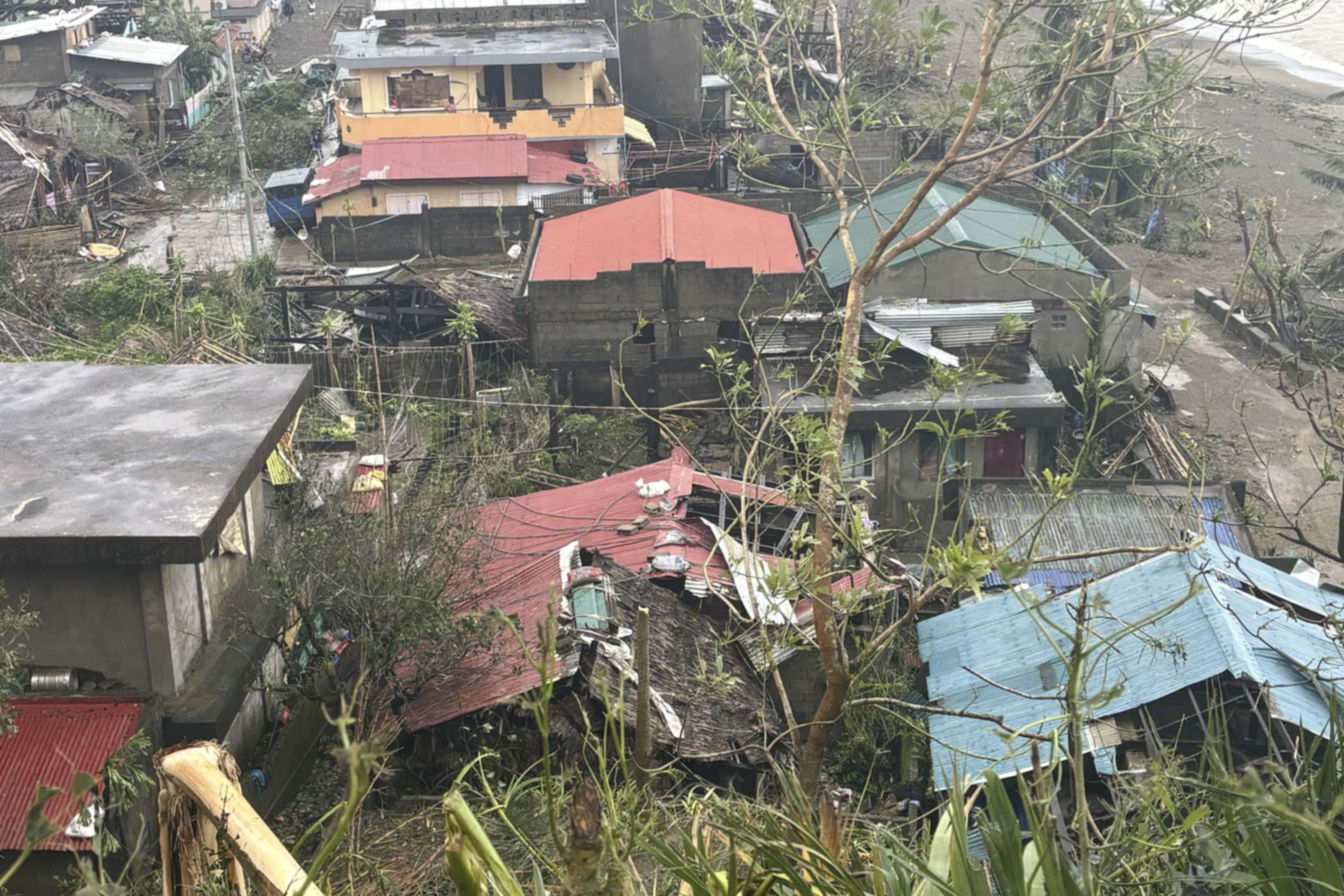 This photo provided by the MDRRMO Viga Catanduanes, shows damaged houses caused by Typhoon Man-yi in Viga, Catanduanes province, northeastern Philippines Sunday, Nov. 17, 2024. (MDRRMO Viga Catanduanes via AP)