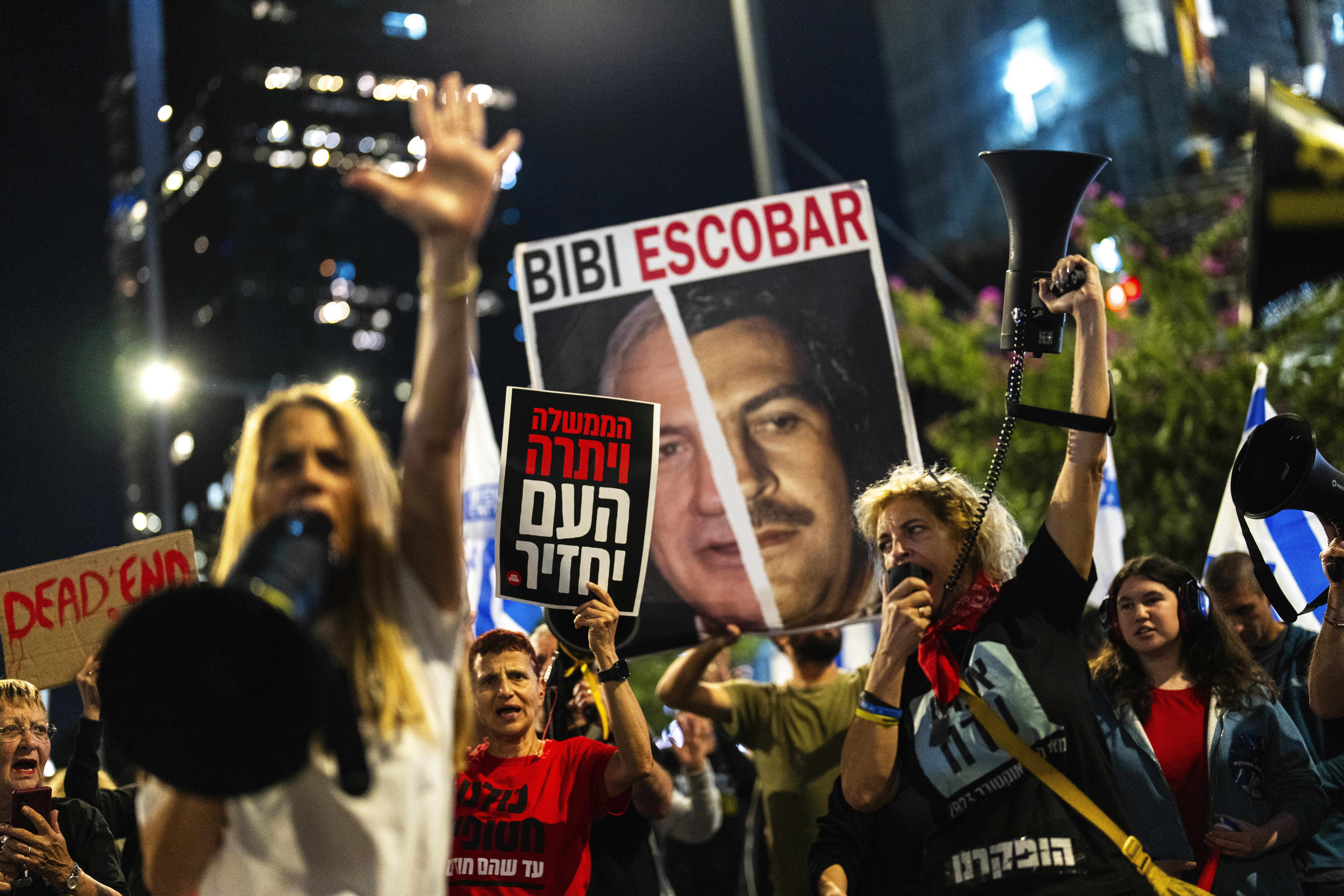 People shout slogans during a protest against Prime Minister Benjamin Netanyahu's government and call for the release of hostages held in the Gaza Strip by the Hamas militant group, in Tel Aviv, Israel, Saturday, Nov. 16, 2024. (AP Photo/Francisco Seco)