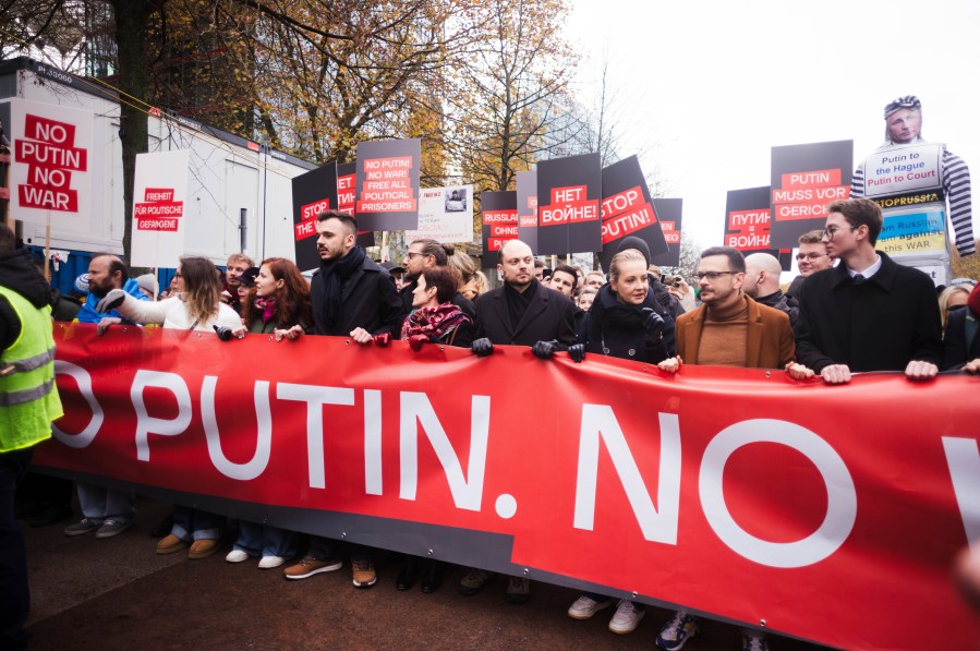 Yulia Navalnaya, third from right, leads with Russian opposition politics Vladimir Kara-Murza, center, and Ilya Yashin, second from right, a demonstration under the slogan "Stop Putin! Stop the War! Freedom for Political Prisoners!" in Berlin, Germany, Sunday, Nov. 17, 2024. (AP Photo/Markus Schreiber)