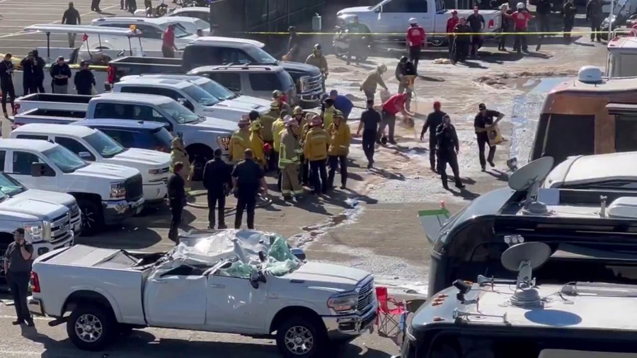 This image taken from video provided by Jerry Jordan shows the fire department and others working at the site of a single-engine plane crash Sunday, Nov. 17, 2024, near a Southern California racing event, in Pomona, Calif., about 30 miles (50 kilometers) east of downtown Los Angeles. (Jerry Jordan via AP)