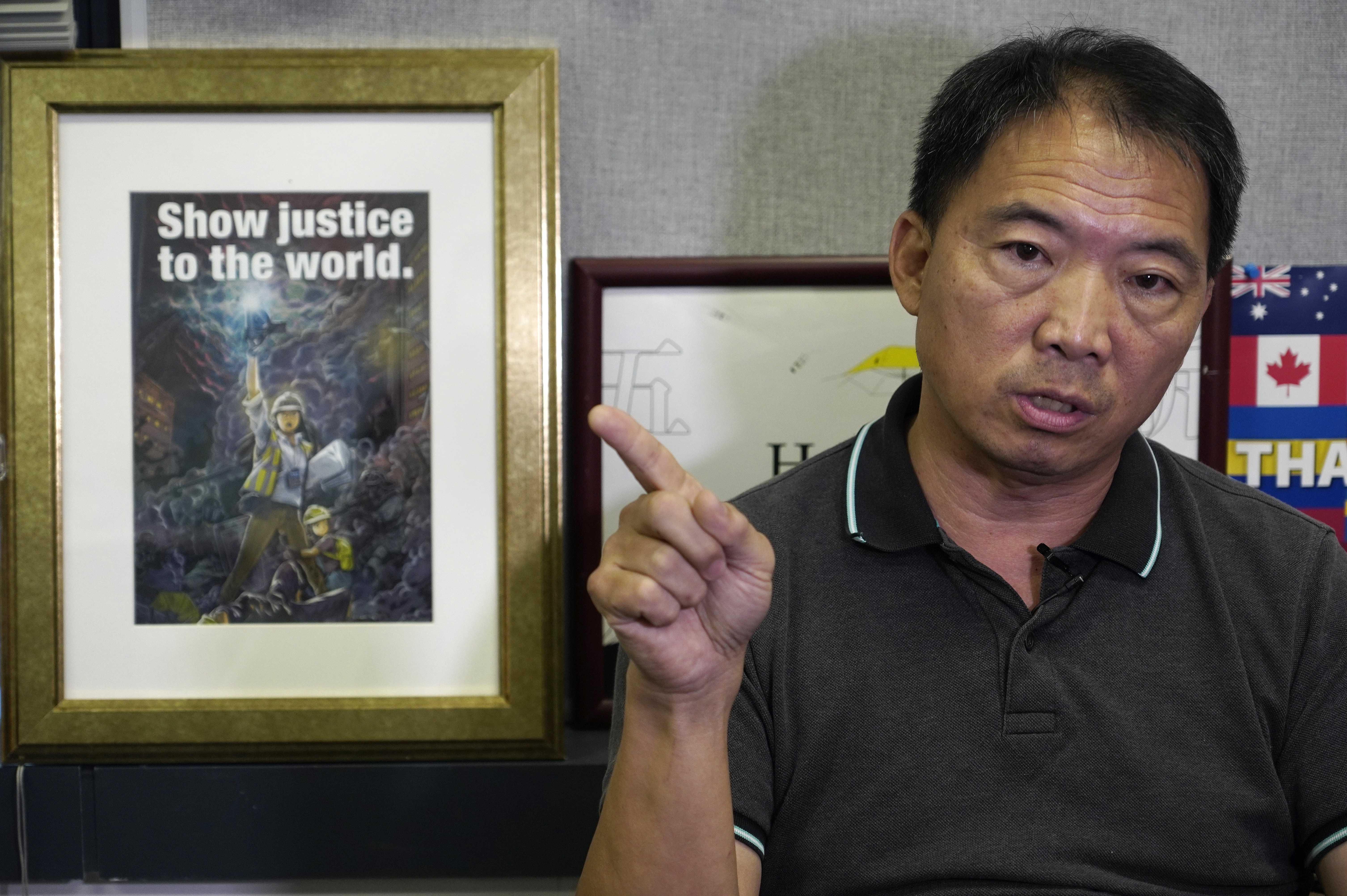 FILE - Pro-democracy lawmaker Wu Chi-wai gestures during an interview at his office in Legislative Council in Hong Kong on Nov. 19, 2020. (AP Photo/Vincent Yu, File)