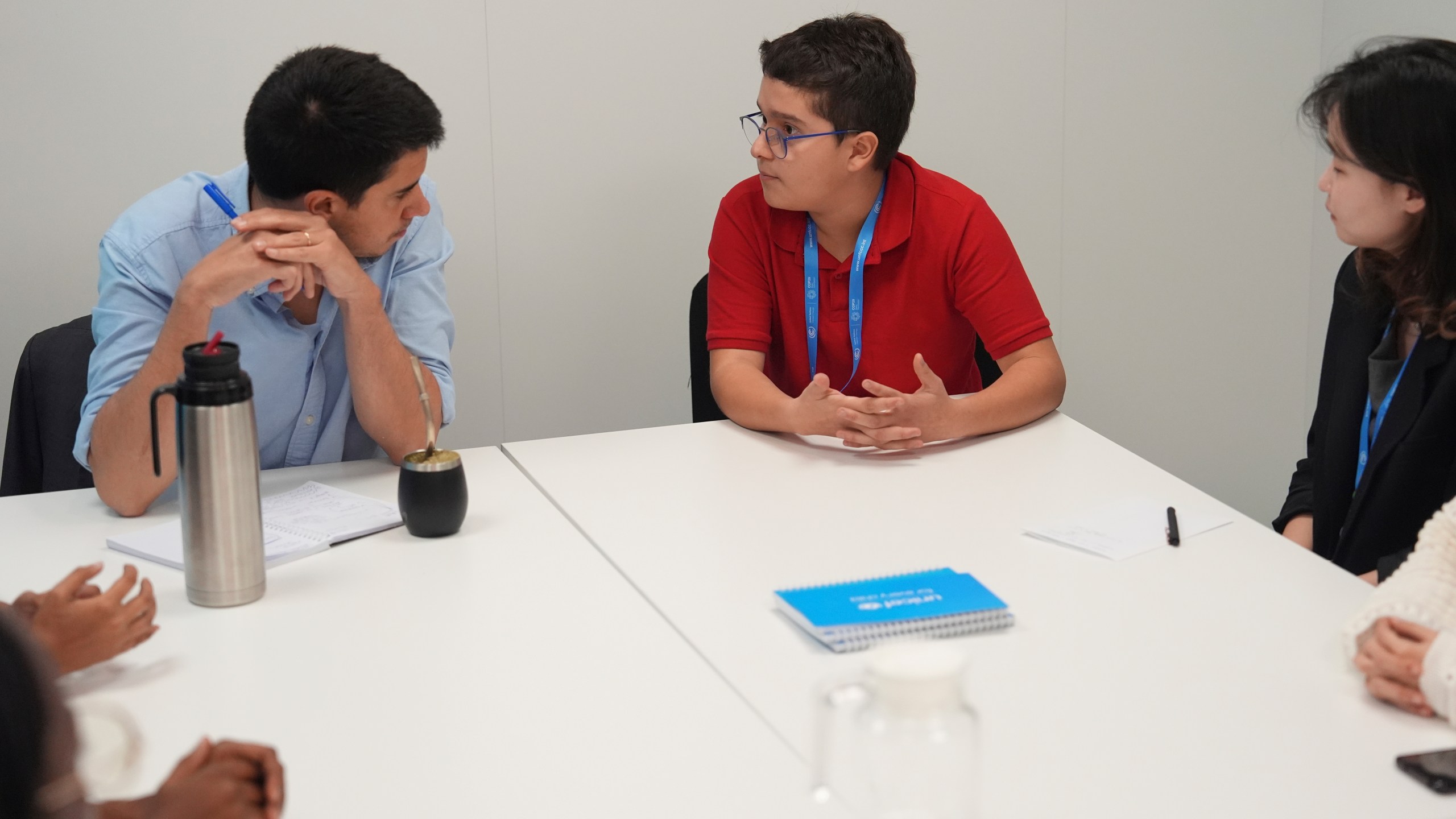 Francisco Vera Manzanares, 15, center, a climate activist from Colombia, speaks with Felipe Paullier, left, U.N. assistant secretary-general for youth affairs, during a forum with young activists, Tuesday, Nov. 12, 2024, at the COP29 U.N. Climate Summit in Baku, Azerbaijan. (AP Photo/Joshua A. Bickel)