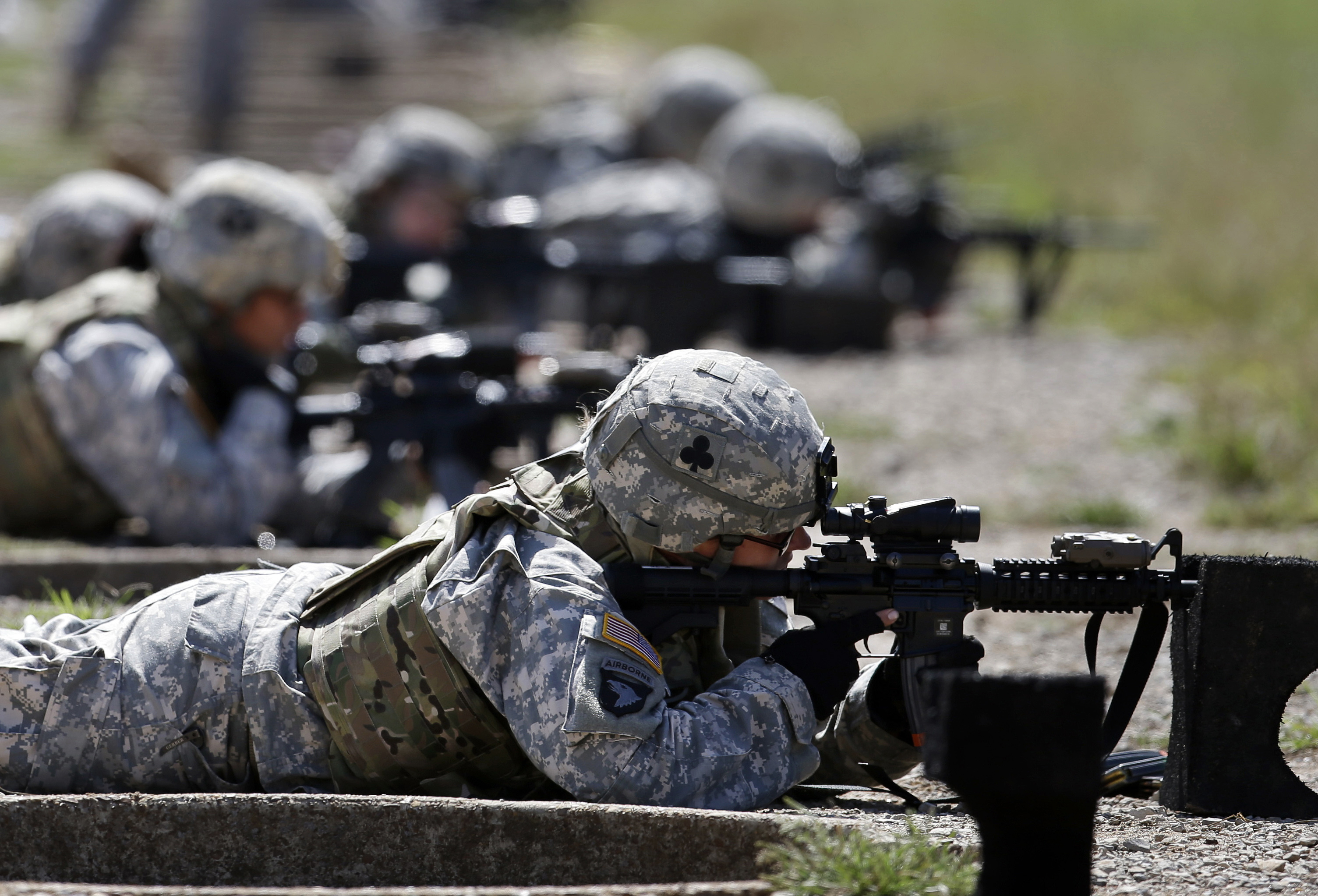 FILE - Female soldiers from 1st Brigade Combat Team, 101st Airborne Division train on a firing range while testing new body armor in Fort Campbell, Ky., Sept. 18, 2012. (AP Photo/Mark Humphrey, File)