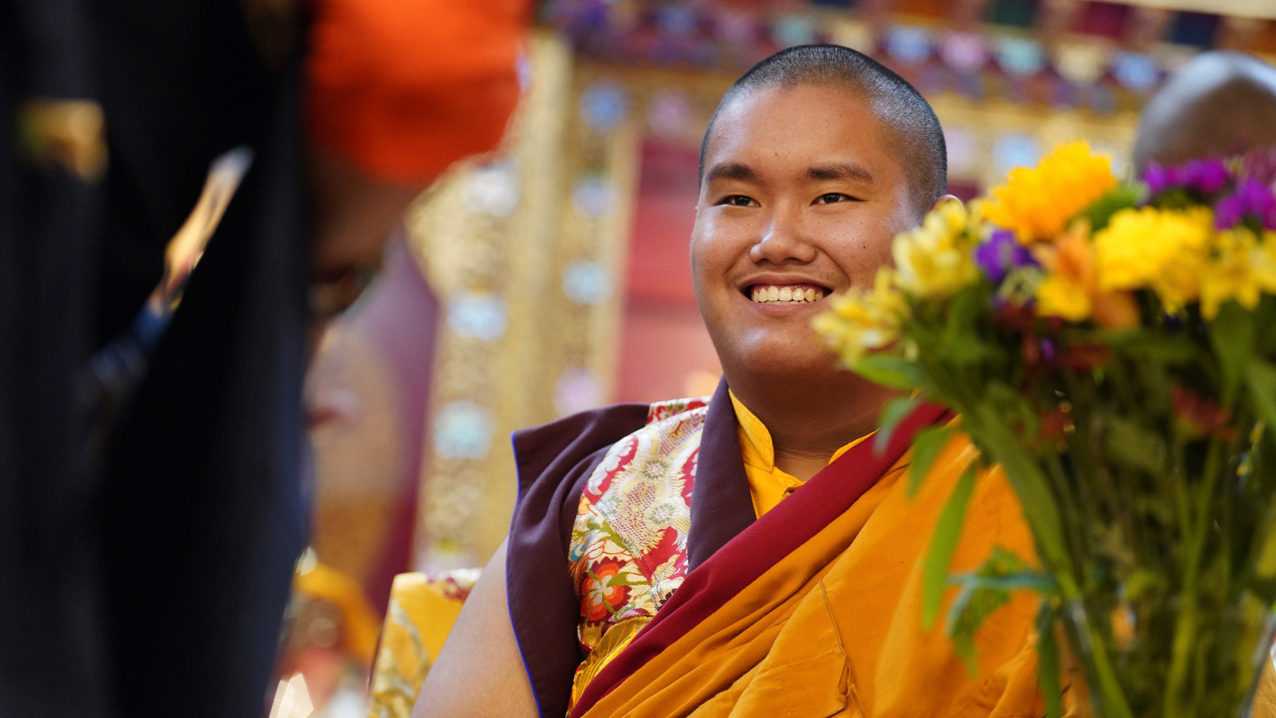 U.S.-born Buddhist lama, Jalue Dorje, is presented with “khata,” the Tibetan ceremonial scarves that symbolize auspiciousness, at his 18th birthday and enthronement ceremony, in Isanti, Minn., on Saturday, Nov. 9, 2024. (AP Photo/Jessie Wardarski)