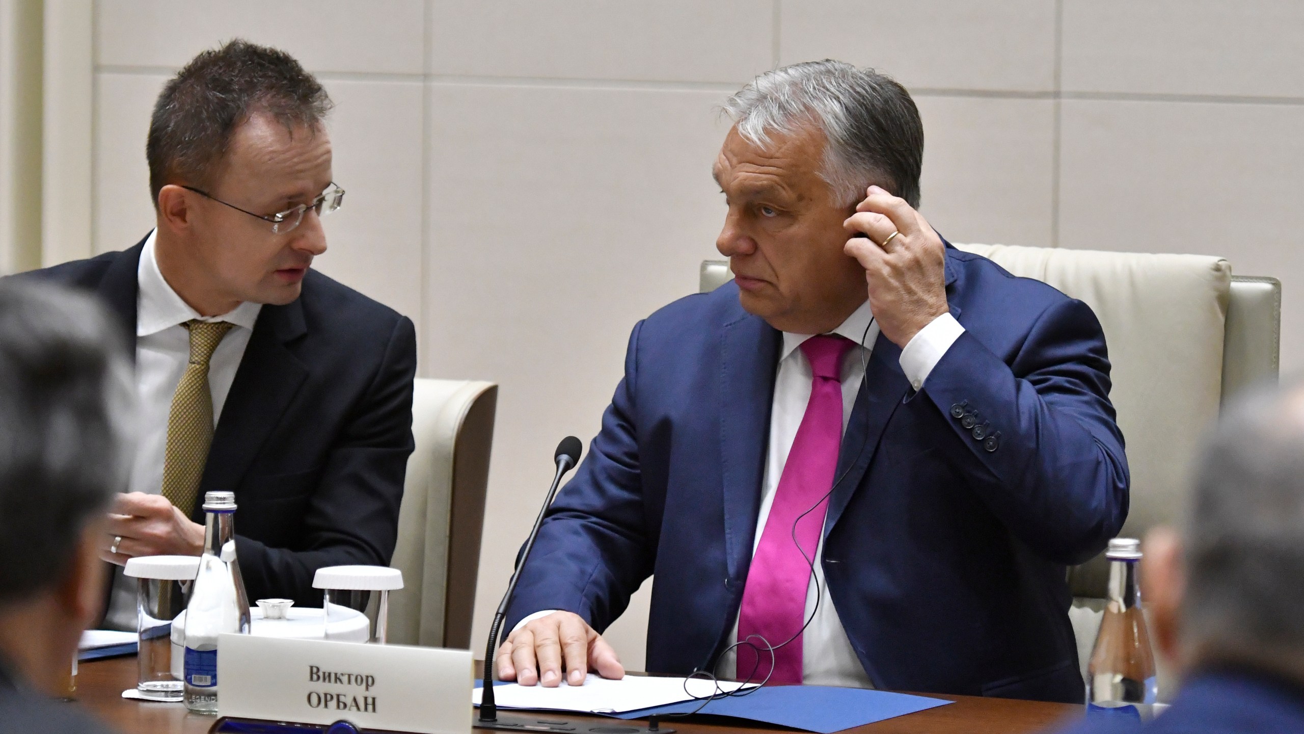 Hungarian Foreign Minister Peter Szijjarto, rear left, and Hungarian Prime Minister Viktor Orban, rear right, attend a meeting with Kyrgyz President Sadyr Japarov at Yntymak Ordo State Residence in Bishkek, Kyrgyzstan, Tuesday, Nov. 5, 2024. (AP Photo/Vladimir Voronin)