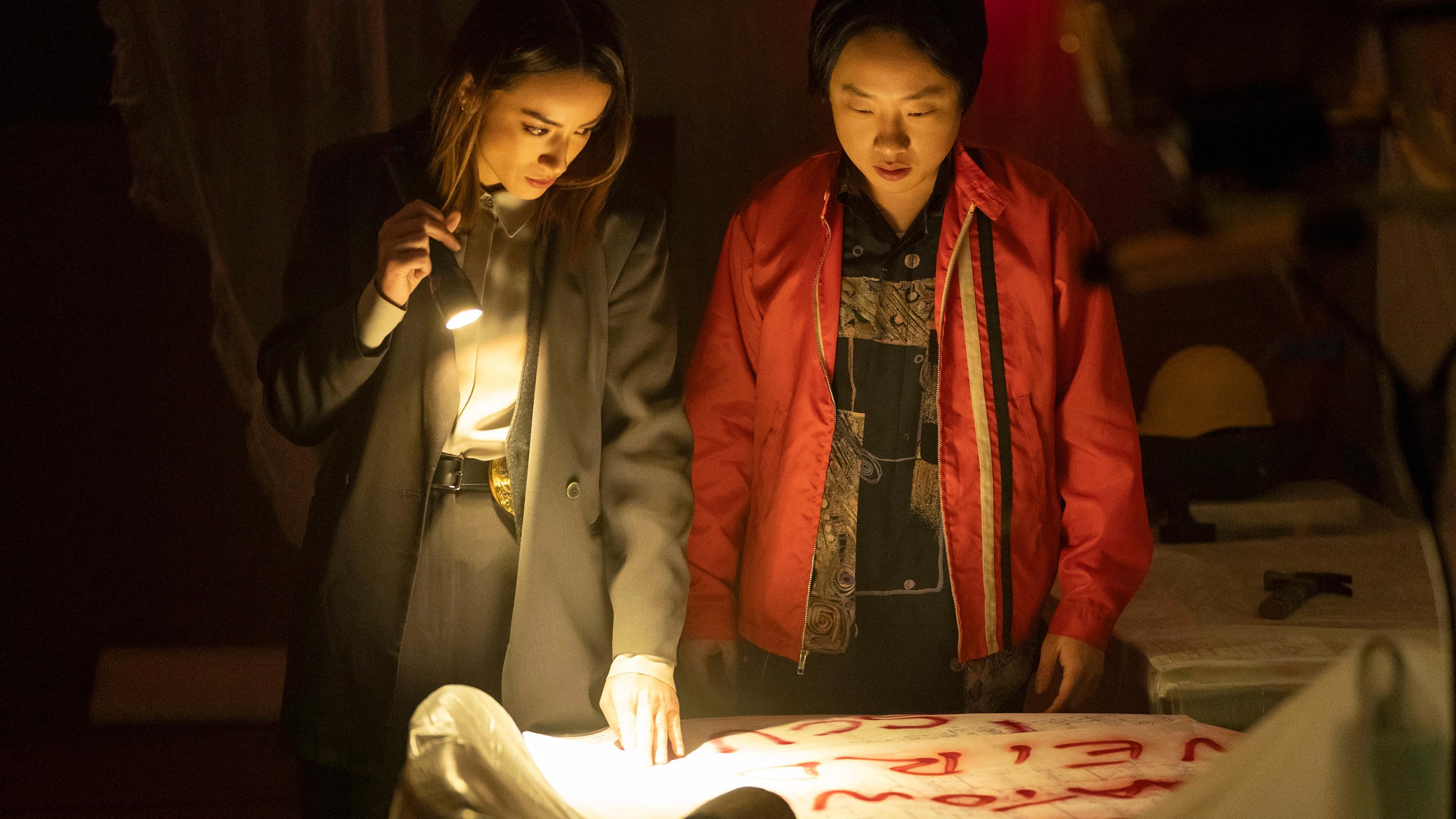 This image released by Hulu shows Chloe Bennet, left, and Jimmy O. Yang in a scene from the series "Interior Chinatown." (Mike Taing/Hulu via AP)