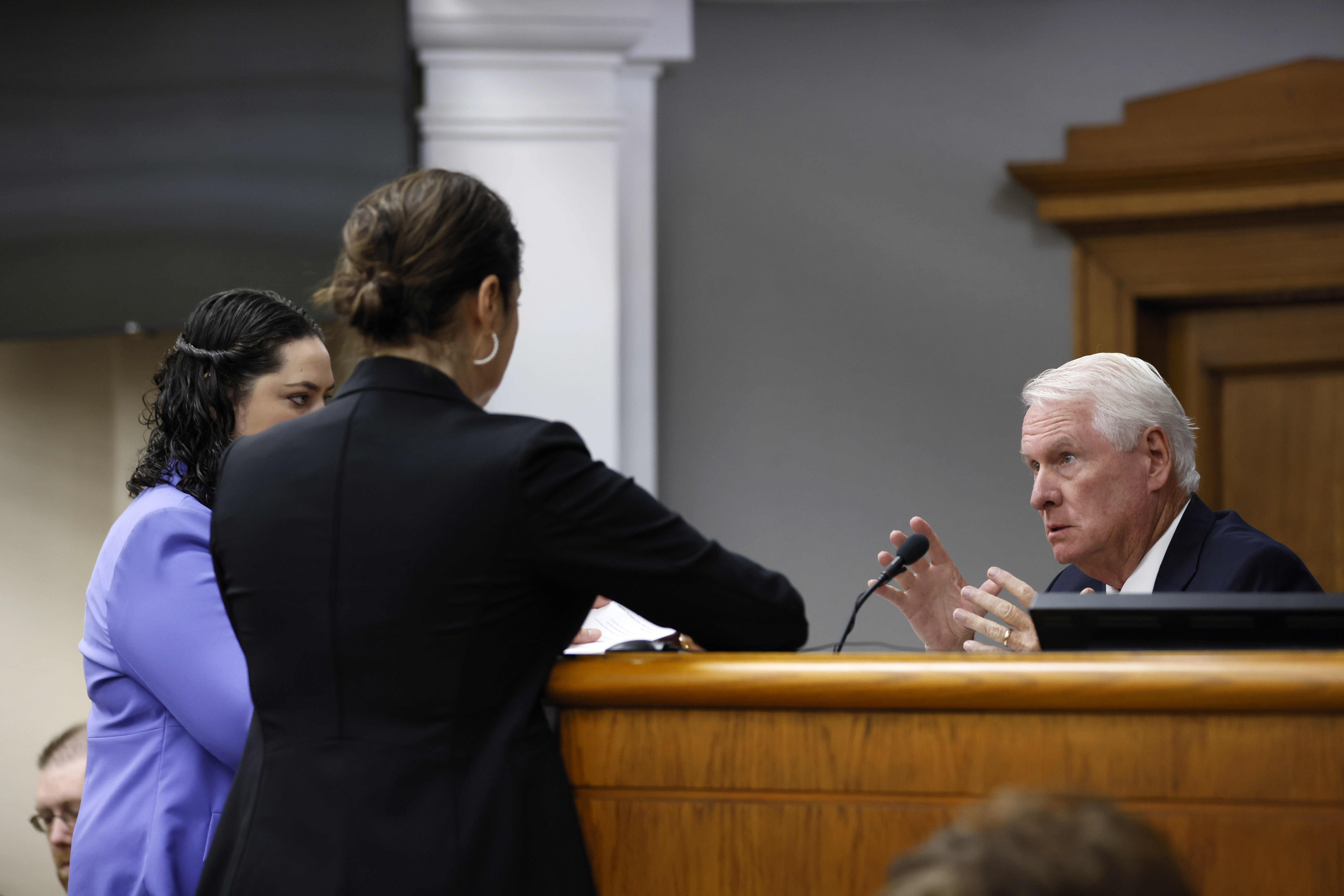 Superior Court Judge H. Patrick Haggard, right, confers with prosecutors and attorneys for Jose Ibarra during the second day of the trial of Jose Ibarra at Athens-Clarke County Superior Court on Monday, Nov. 18, 2024, in Athens, Ga. (Miguel Martinez/Atlanta Journal-Constitution via AP, Pool)