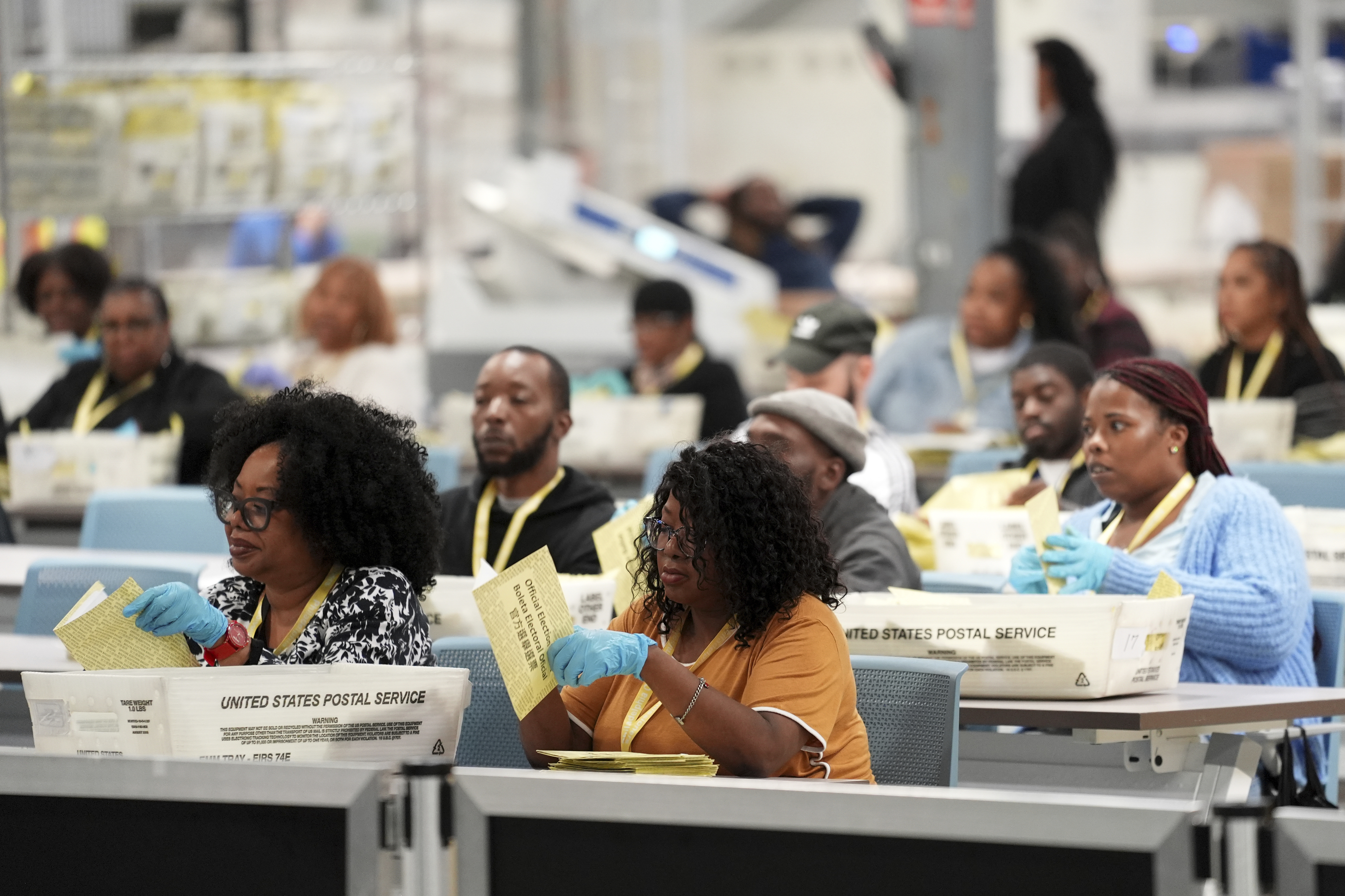 Election workers process mail-in ballots for the 2024 General Election at the Philadelphia Election Warehouse, Tuesday, Nov. 5, 2024, in Philadelphia. (AP Photo/Matt Rourke)