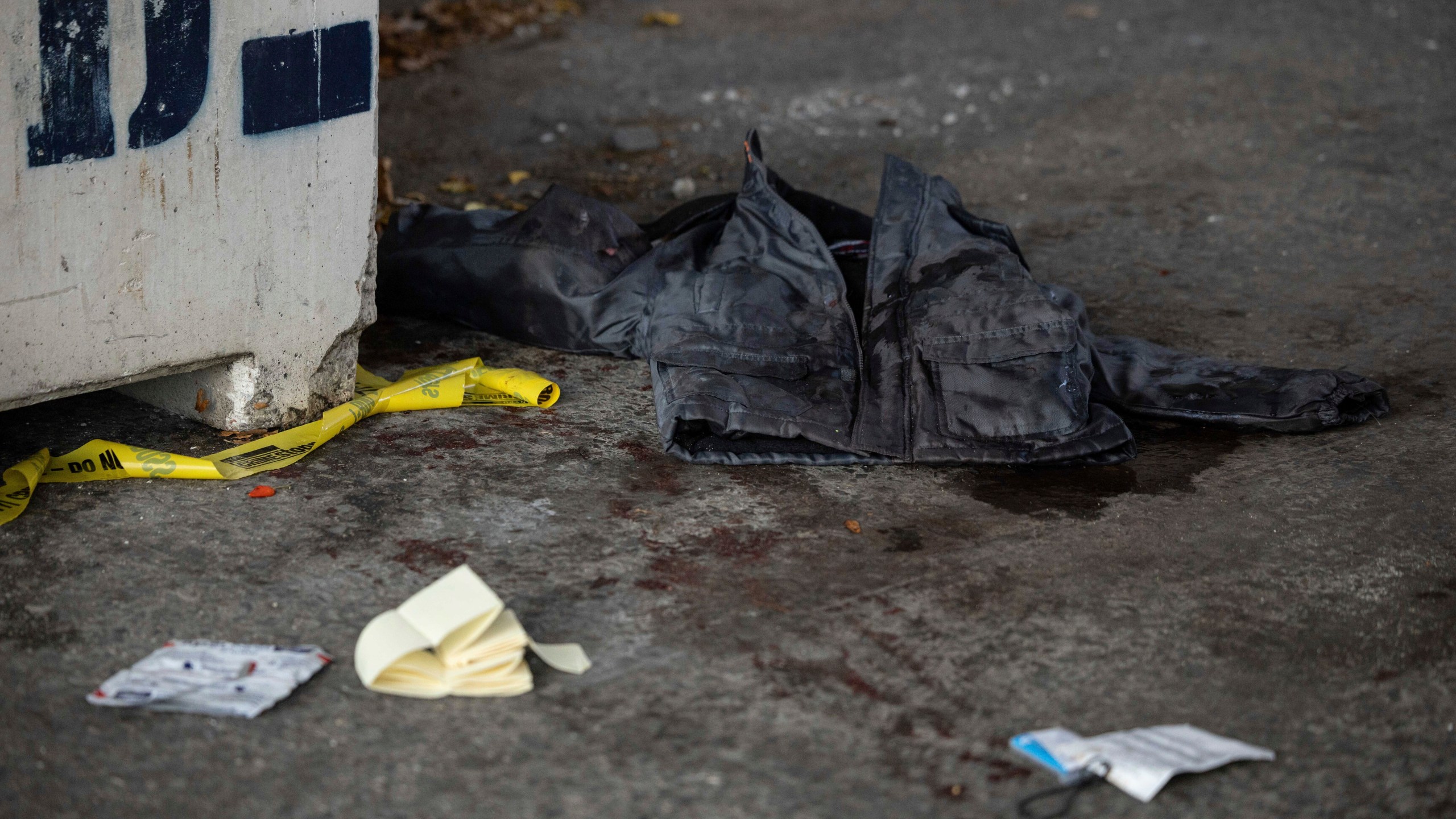 A jacket covered in blood lays on the ground at the site of a stabbing spree near the United Nations Headquarters in New York, Monday, Nov. 18, 2024. (AP Photo/Yuki Iwamura)