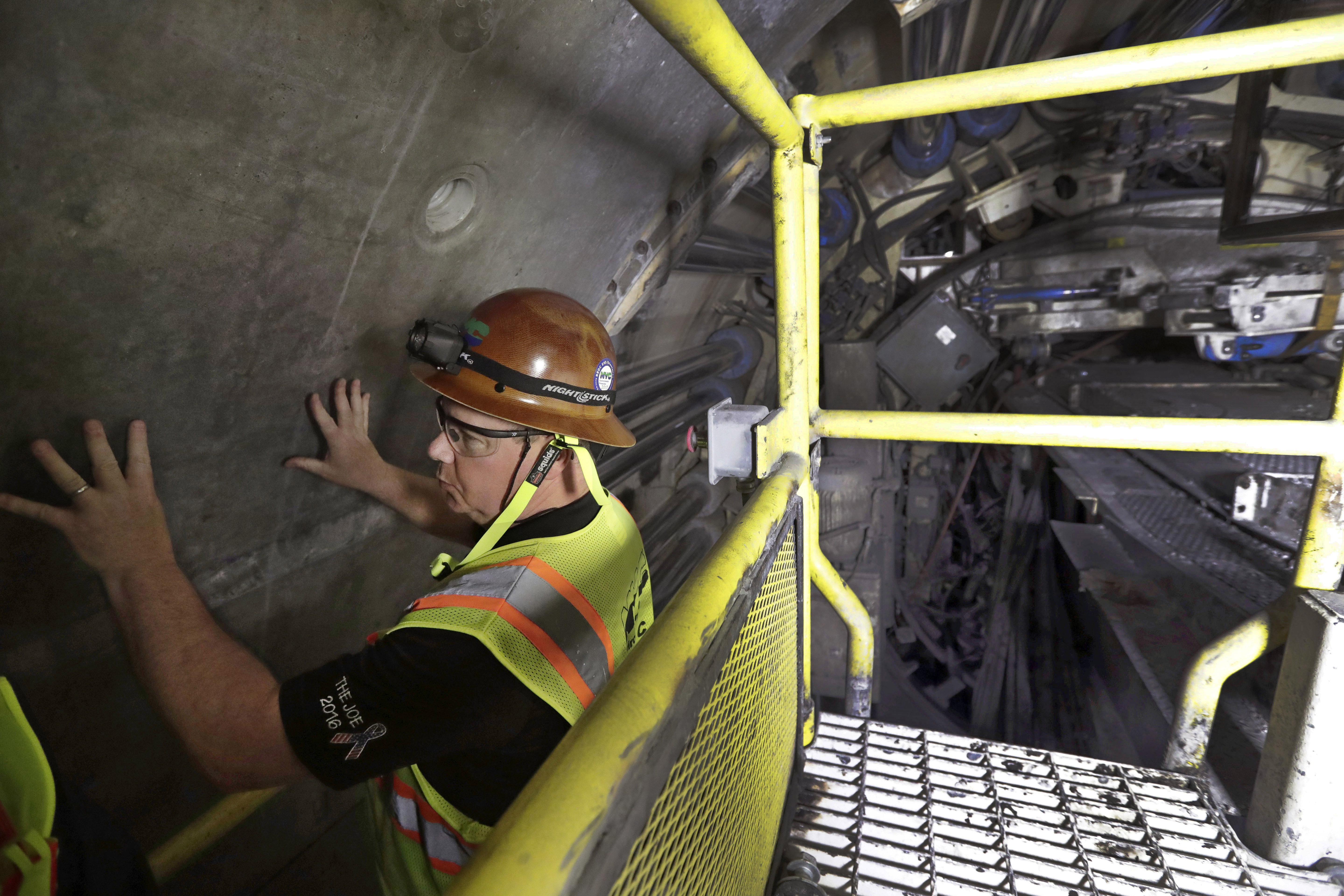 FILE - Mike Schmitt, project manager for the New York State Department of Environmental Protection, explains the design and construction of a 2.5-mile bypass tunnel for the Delaware Aqueduct in Marlboro, N.Y., May 16, 2018. (AP Photo/Julie Jacobson, File)