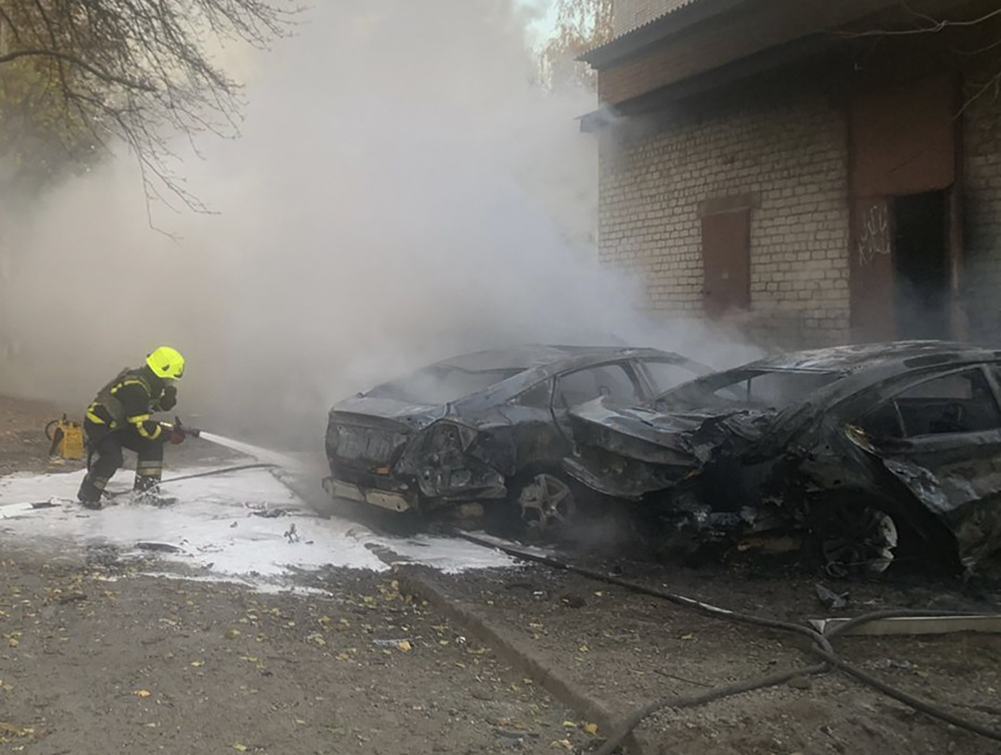 In this photo provided by the Ukrainian Emergency Service, emergency services personnel work to extinguish a fire following a Russian rocket attack in Poltava region, Ukraine, Sunday, Nov. 17, 2024. (Ukrainian Emergency Service via AP)