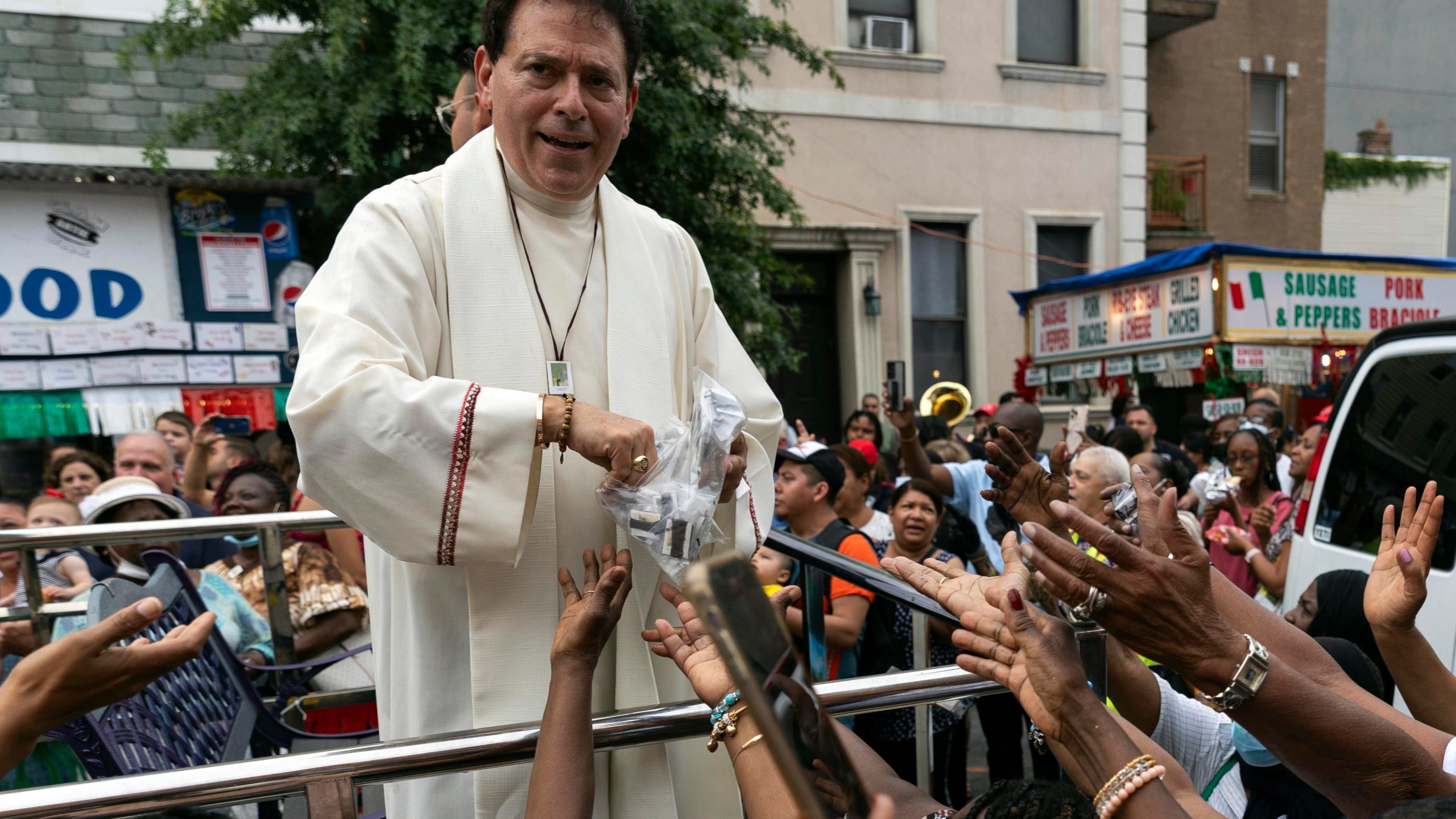 FILE- Former pastor of Shrine Church of Our Lady of Mount Carmel Monsignor Jamie Gigantiello speaks with parishioners, July 16, 2022, in the Brooklyn borough of New York. (AP Photo/Julia Demaree Nikhinson), File