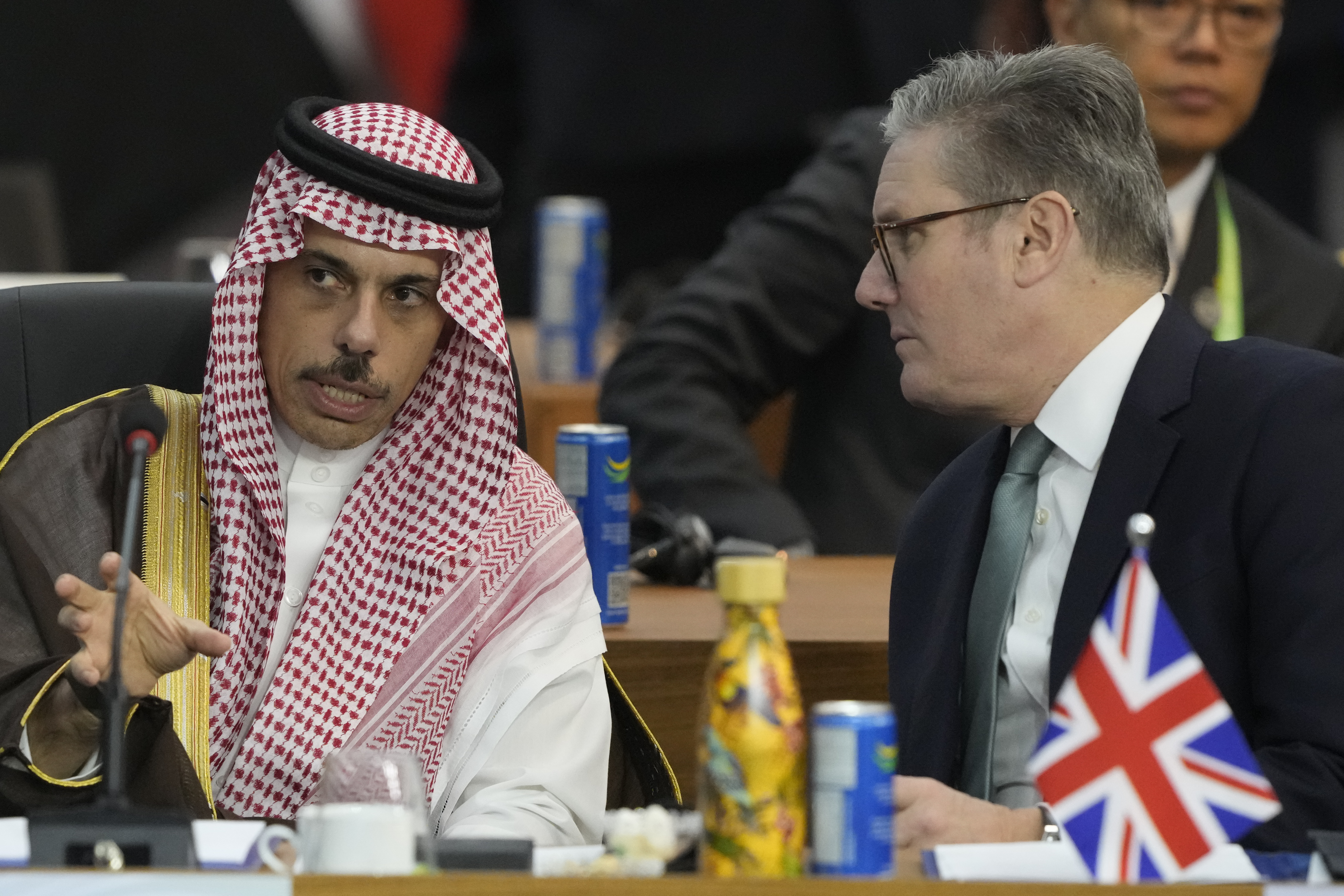 Britain's Prime Minister Keir Starmer, right, and Saudi Arabia's Foreign Minister Prince Faisal bin Farhan Al-Saud talk during the G20 Summit leaders meeting in Rio de Janeiro, Monday, Nov. 18, 2024. (AP Photo/Eraldo Peres)